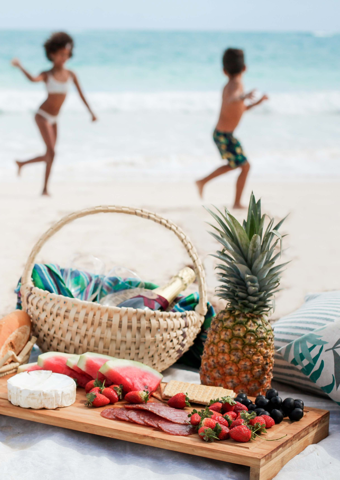 Kids running on the beach during a caribbean family vacation