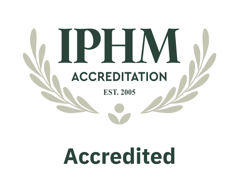 IPHM accreditation seal with laurel branches and the words 'Accredited' and 'EST. 2005'.