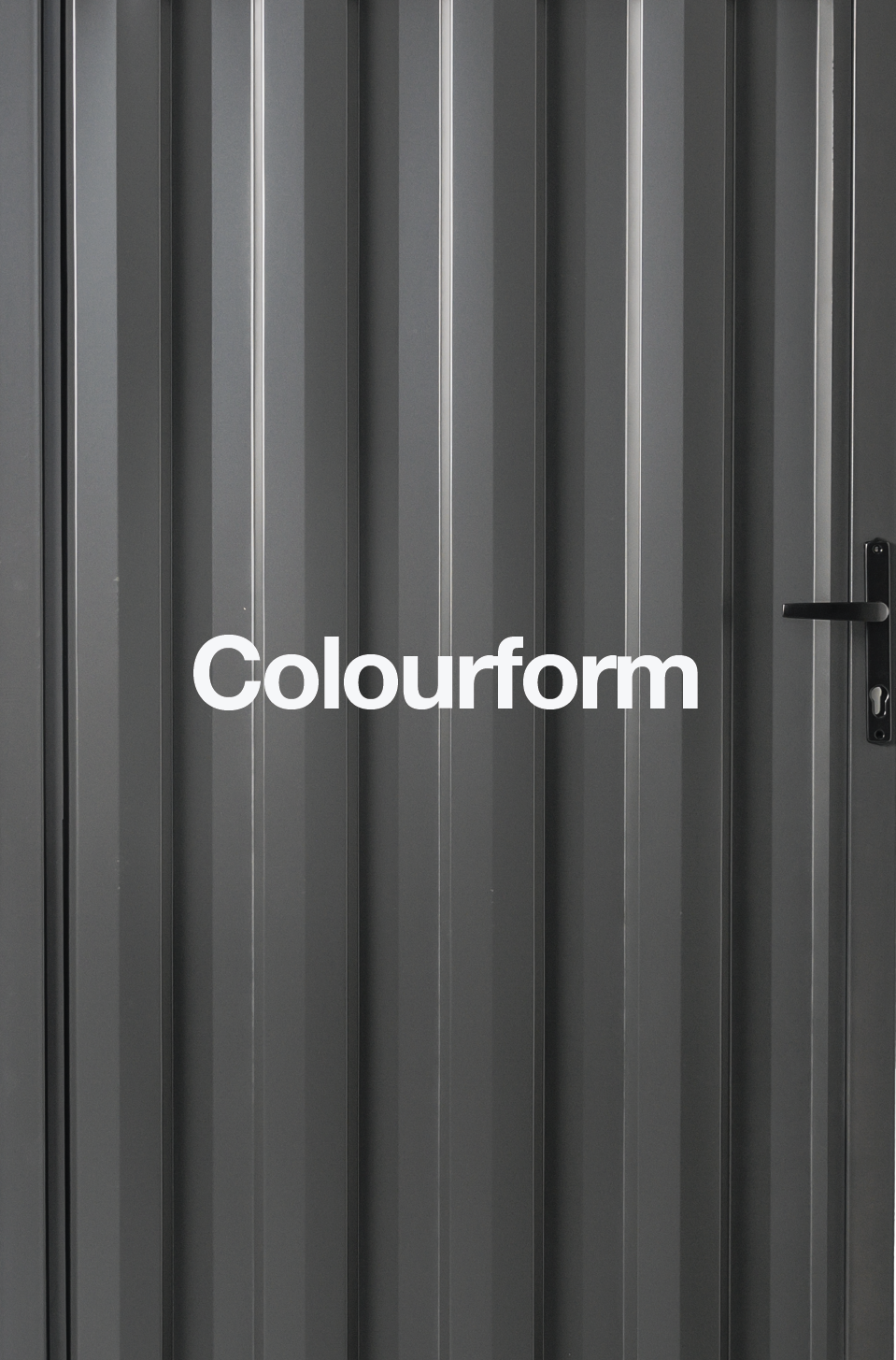 Gray metal door with vertical panels and a black handle, with the word 'Colourform' written across.
