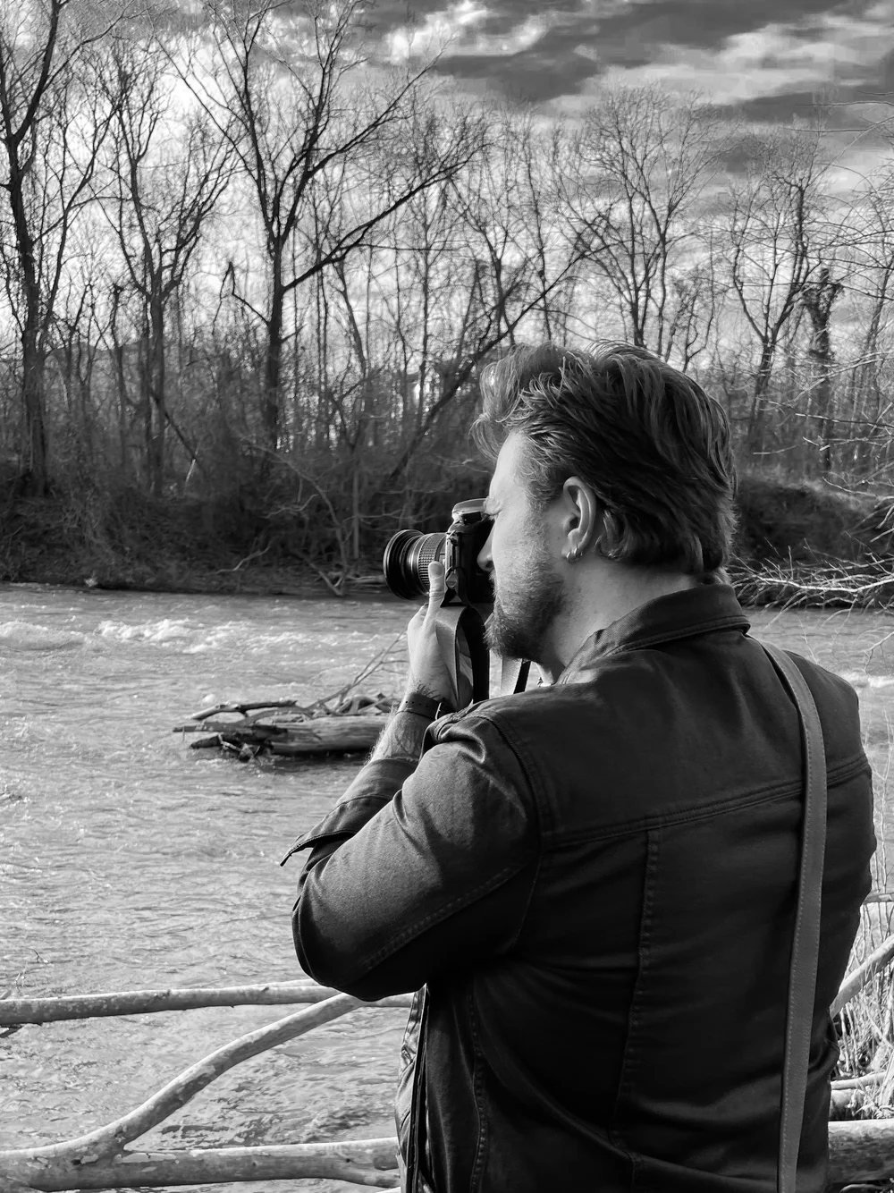 William Everett photographing beside a river in Virginia