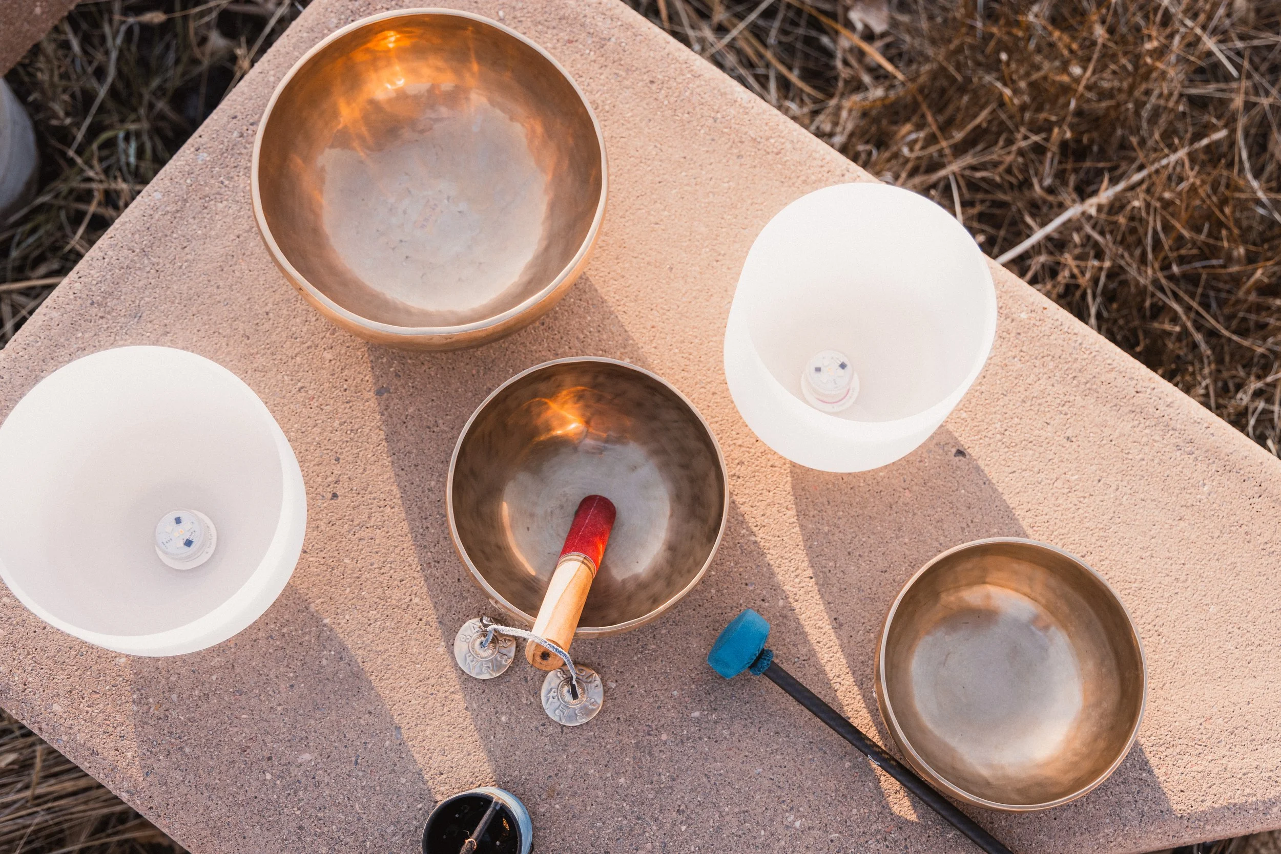 Sound healing bowls on a cement block