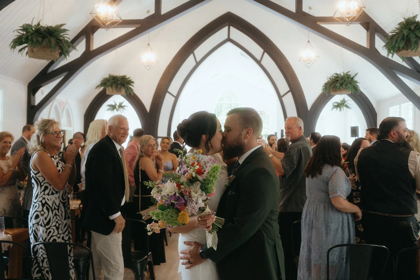 Laurie’s customers, Evan and Kade, running down a mountain after getting married. 