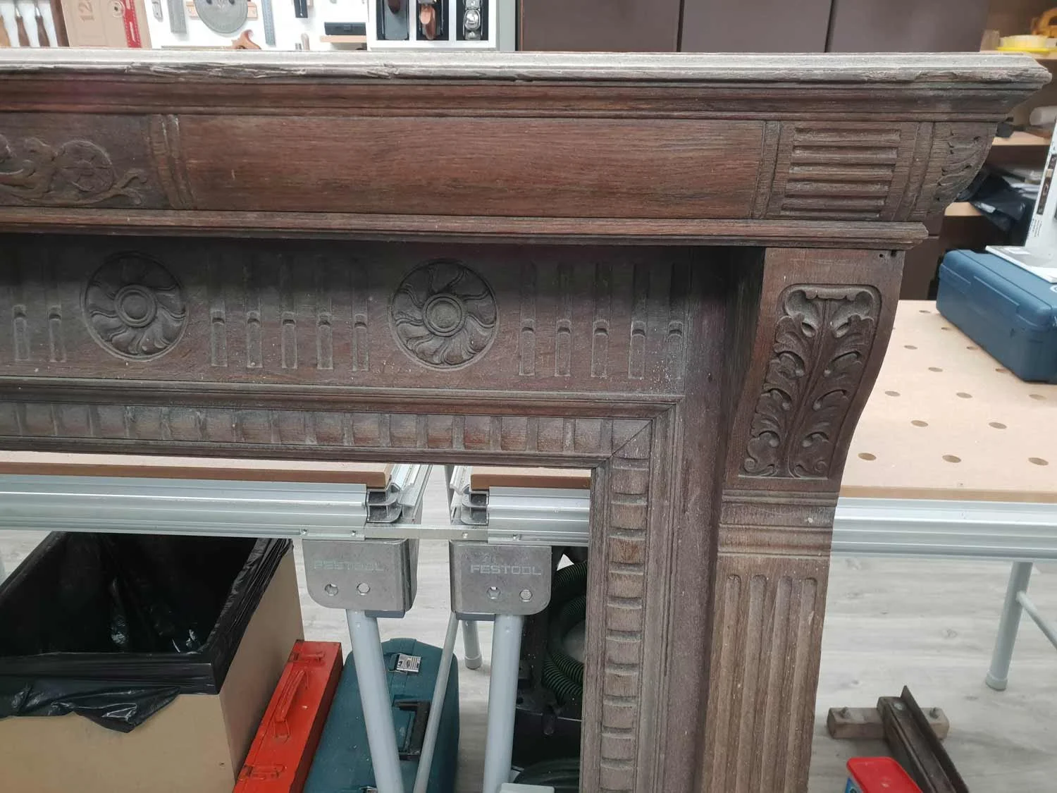 Damaged front of oak fireplace that needs restoration