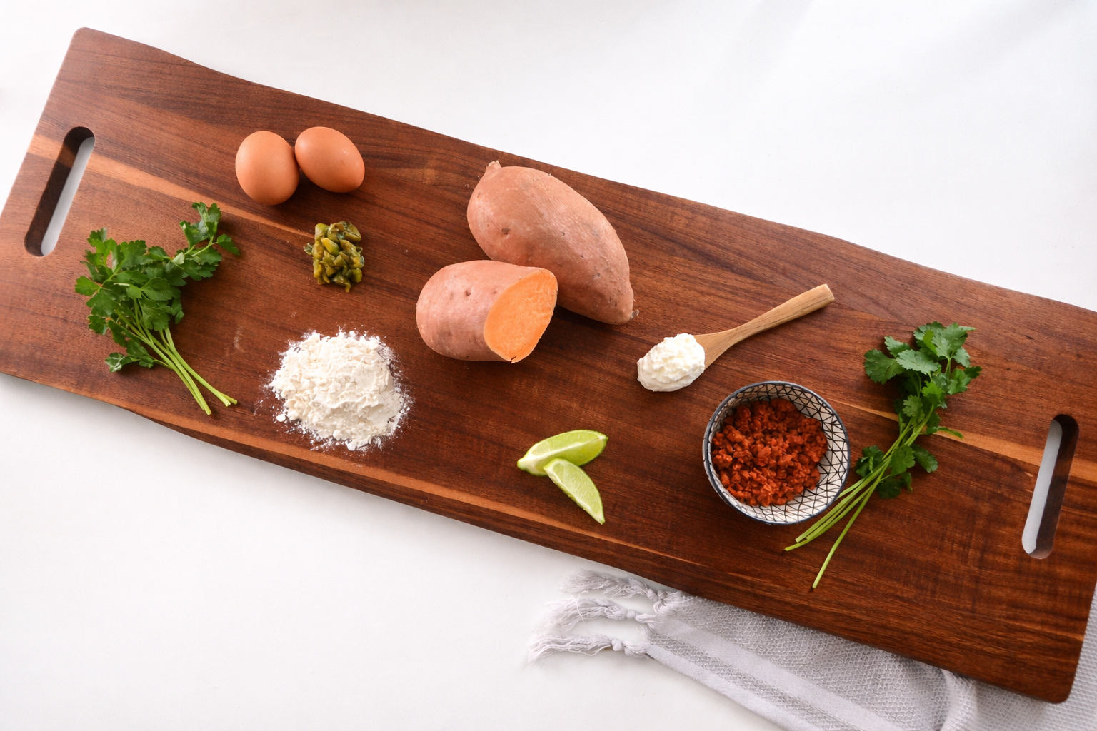 Ingredients for sweet potato and soyrizo ravioli including sweet potatoes, black beans, tortillas, and Hatch chiles
