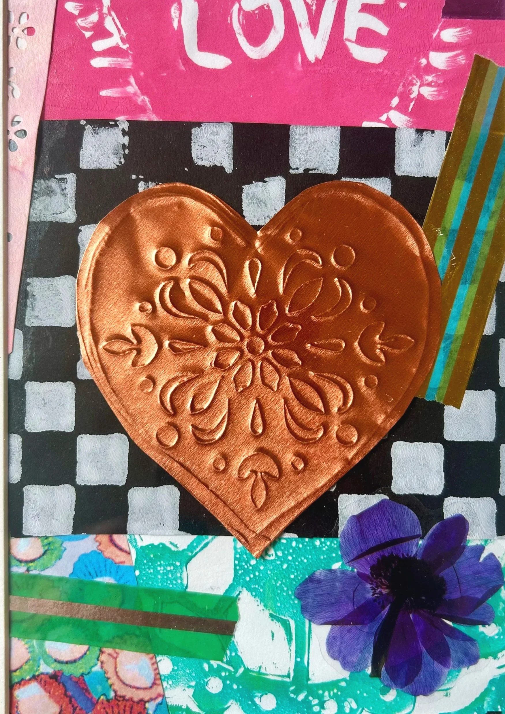 A collage with a pink paper top section with the word 'LOVE' in white, a copper heart with an embossed floral pattern, a purple flower, and colorful striped and patterned papers arranged on a checkerboard and abstract background.