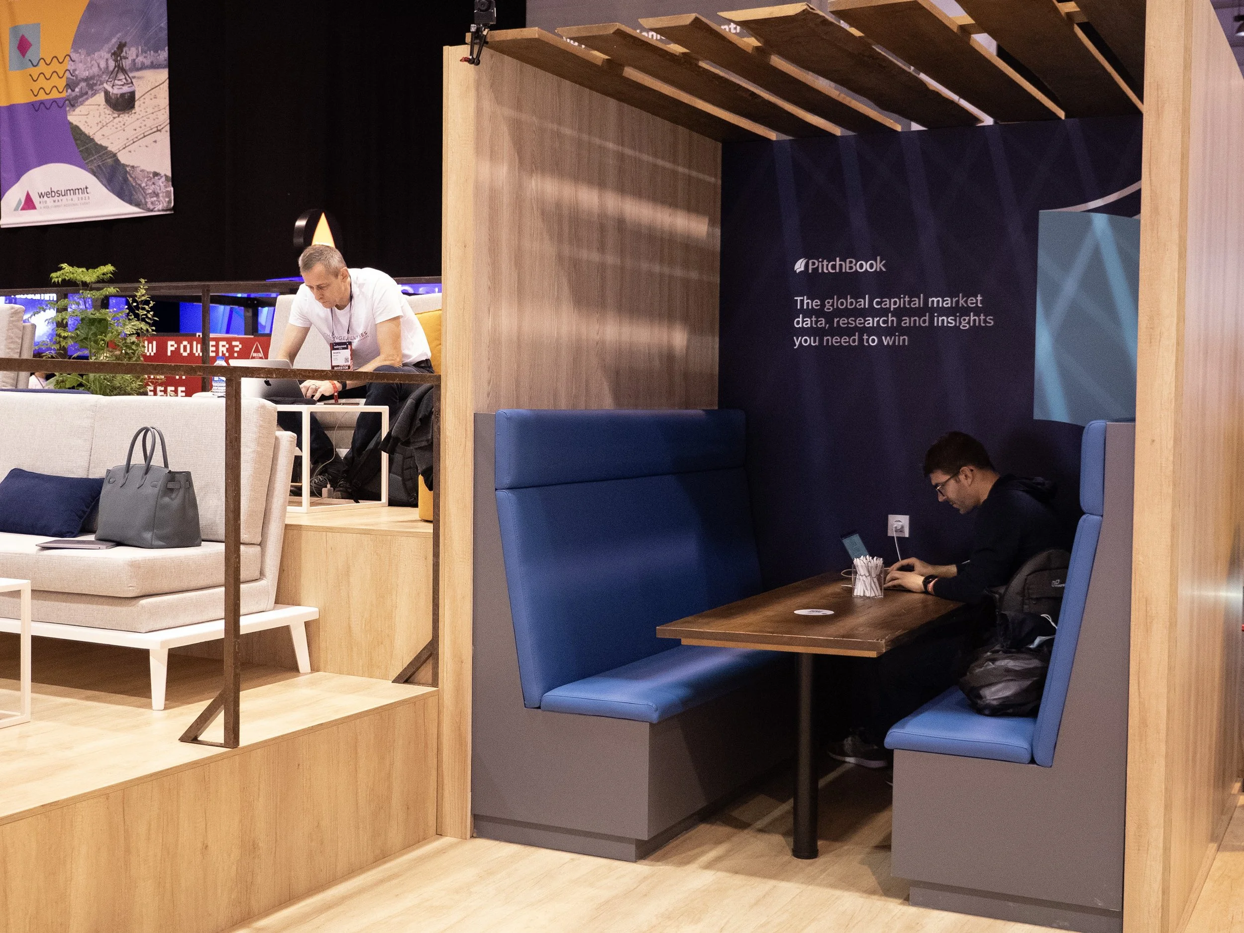 Privacy booth with messaging on back wall