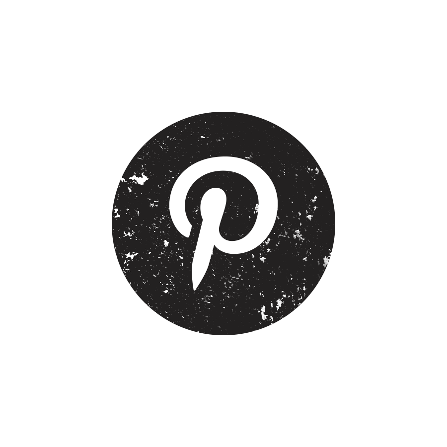 Black-and-white image of a person standing with crossed arms, wearing a long-sleeved shirt and pants, standing outdoors with trees and parked cars in the background.