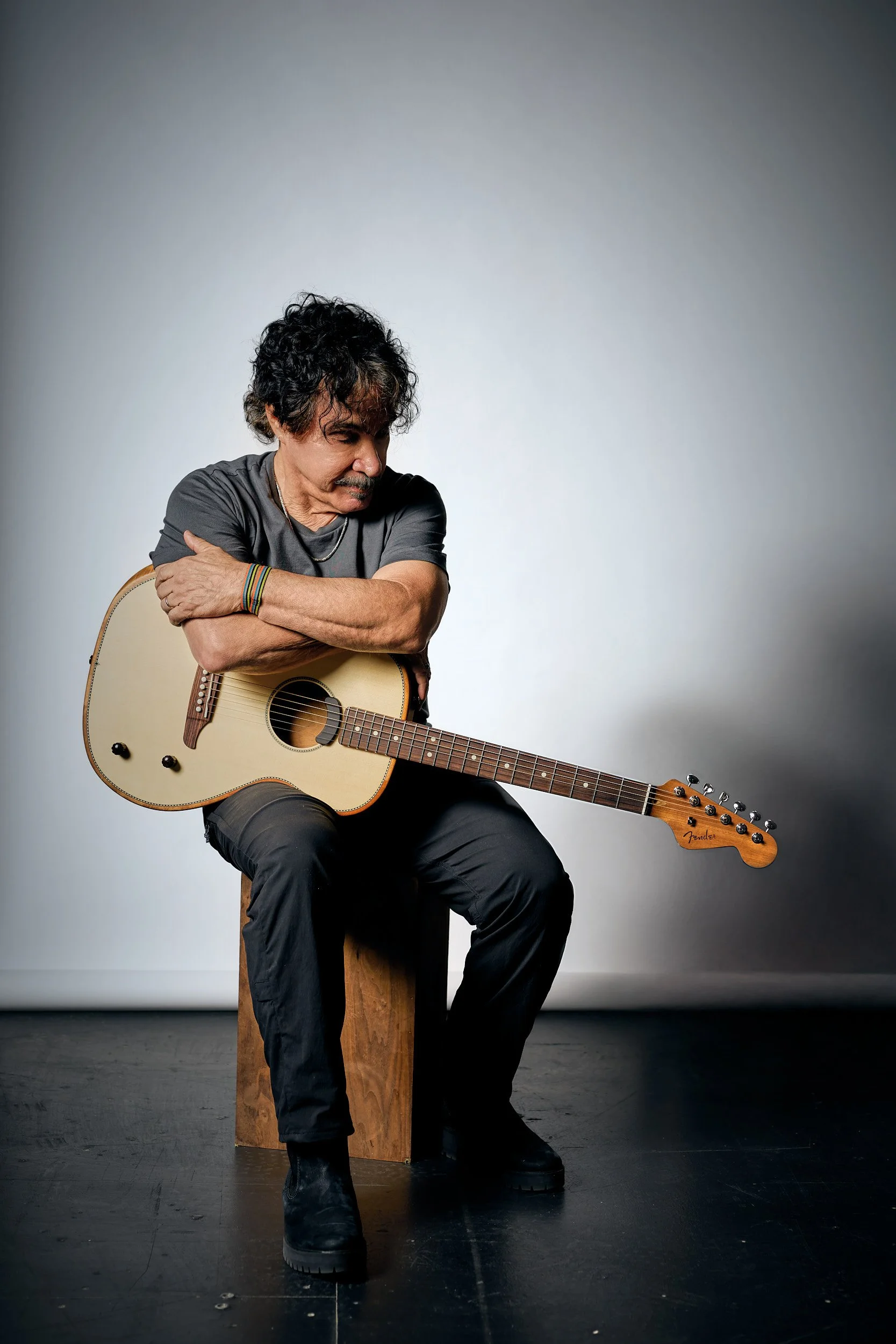 Portrait of musician, John Oates with his guitar