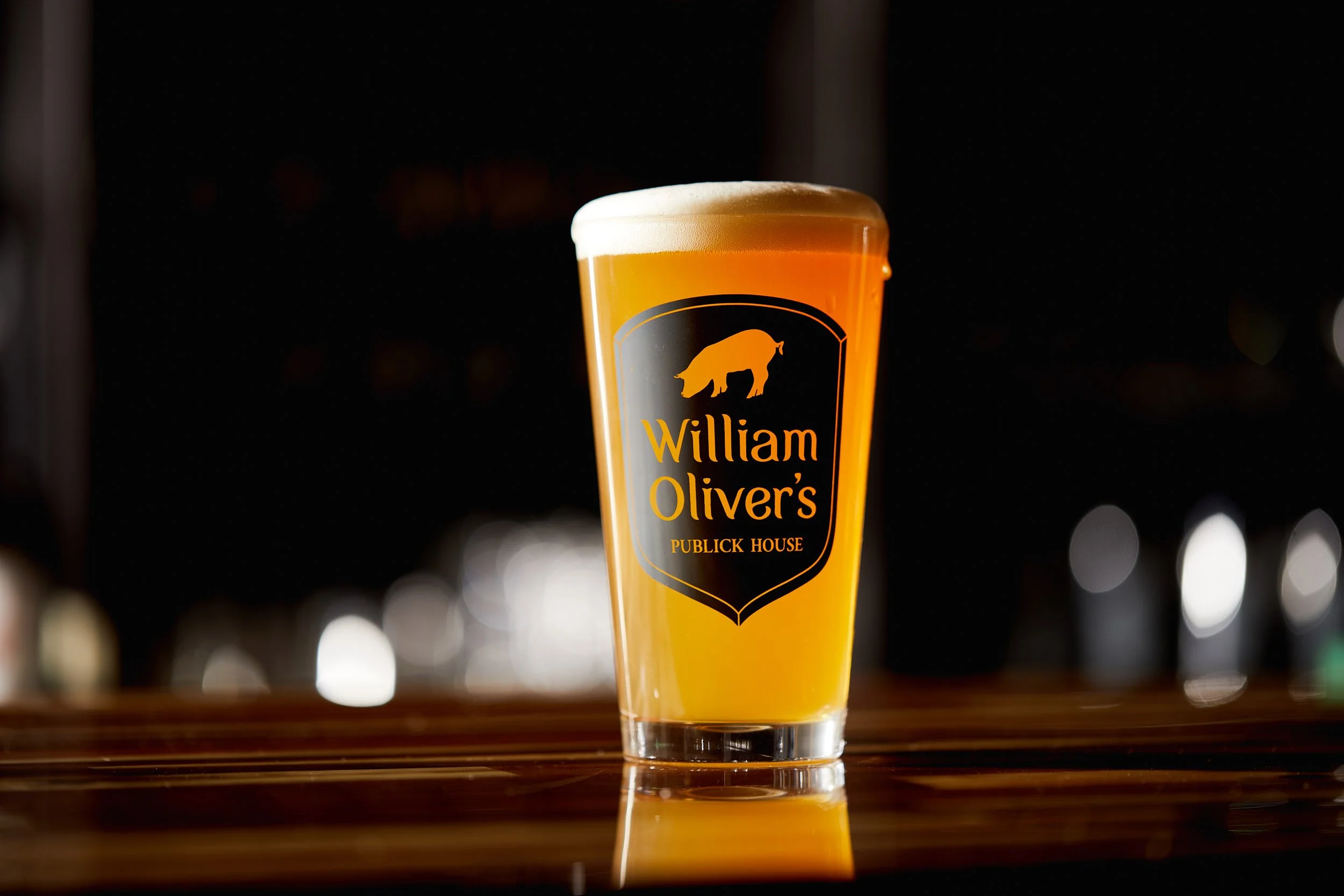 IPA in a William Olivers pint glass sitting on the bar