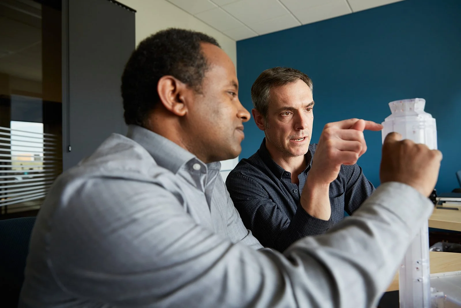 Engineering reviewing a model of a tall building