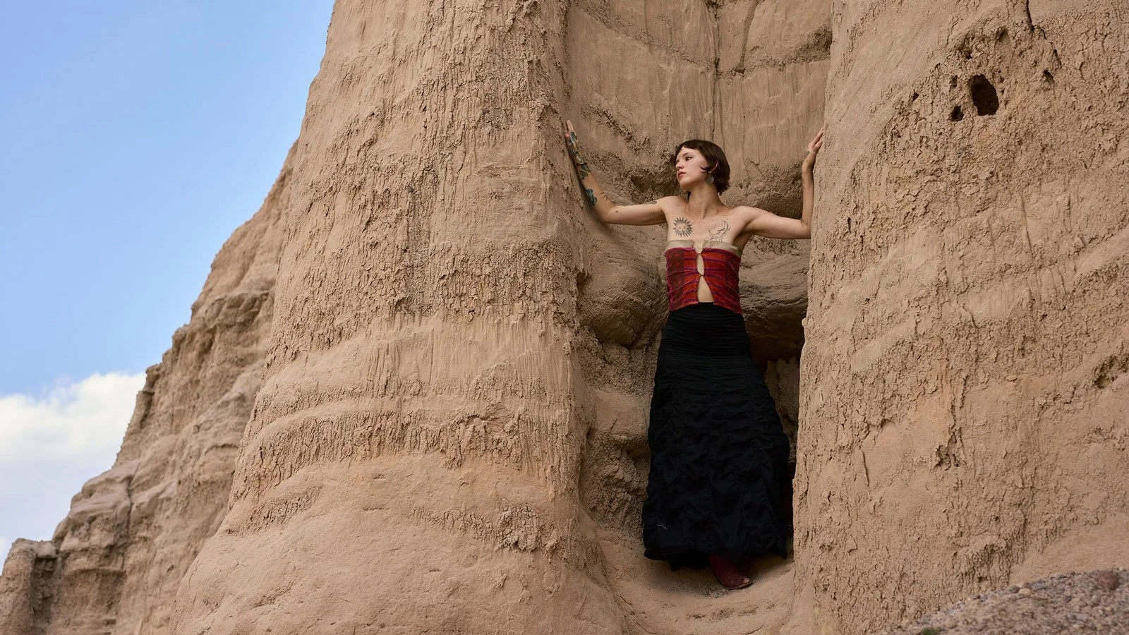 Model posing in sand stone cliffs