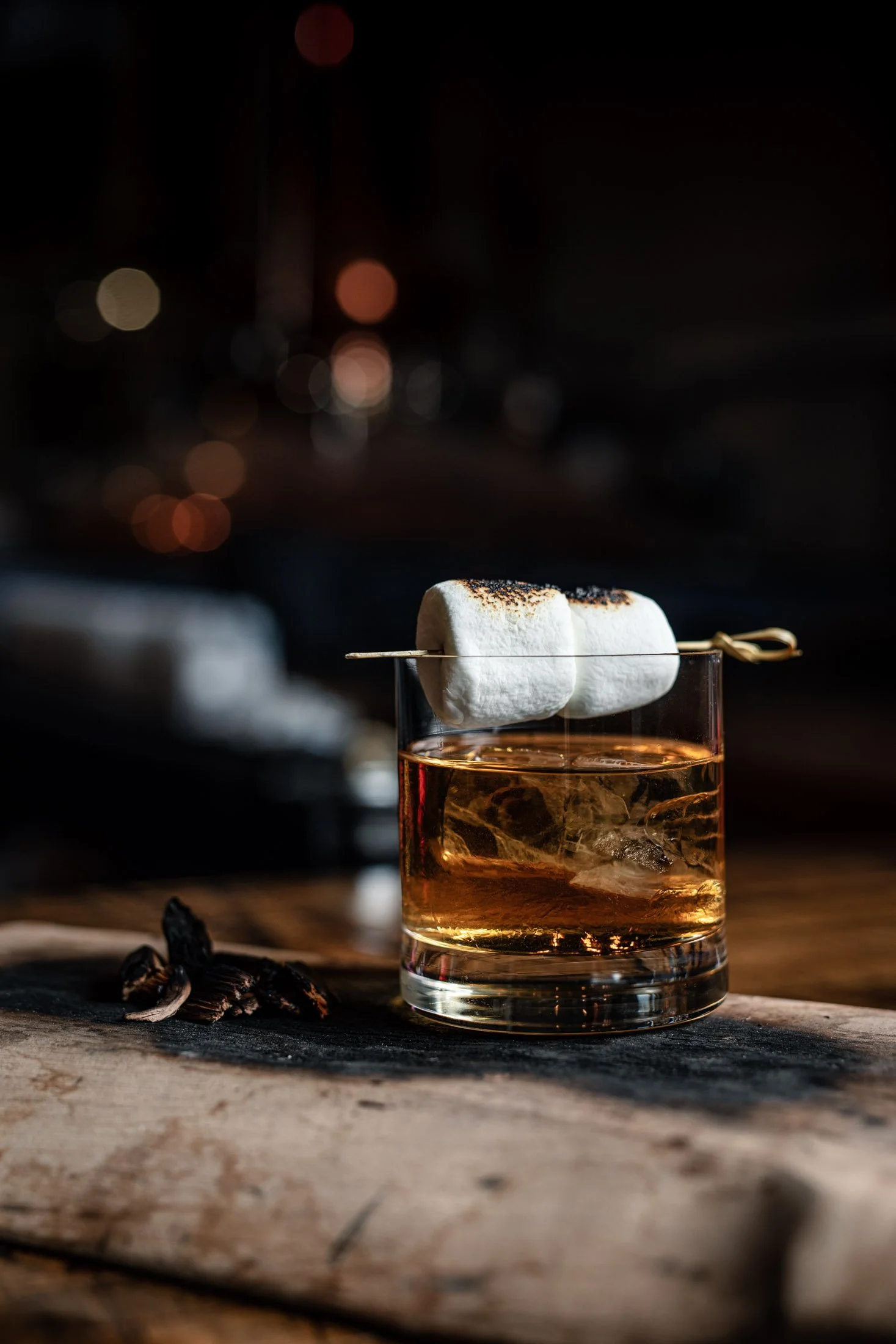 Campfire cocktail with roasted marshmallows at Deviation Distilling in Denver Colorado