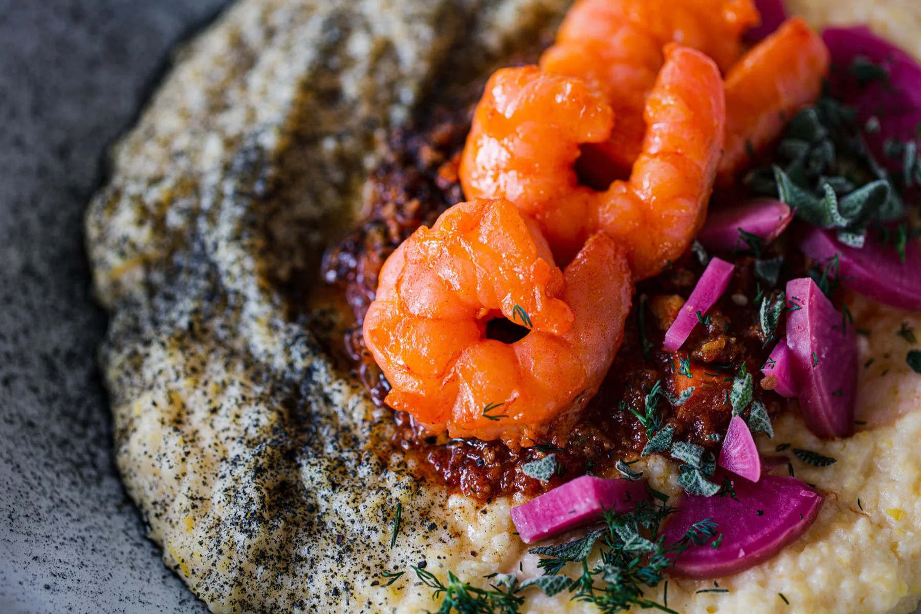 Bright orange shrimp with grits