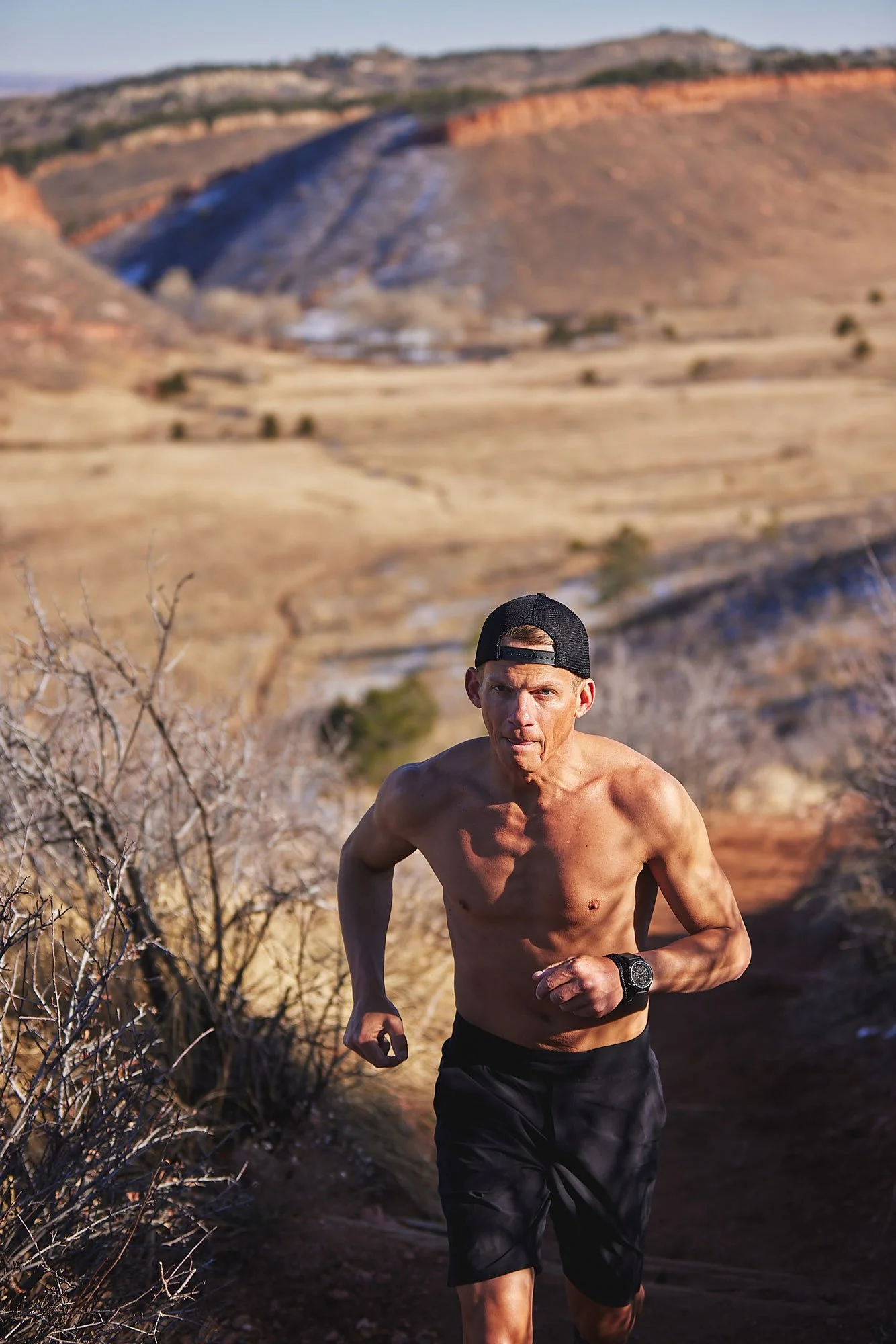 Trail runner ascending a hill