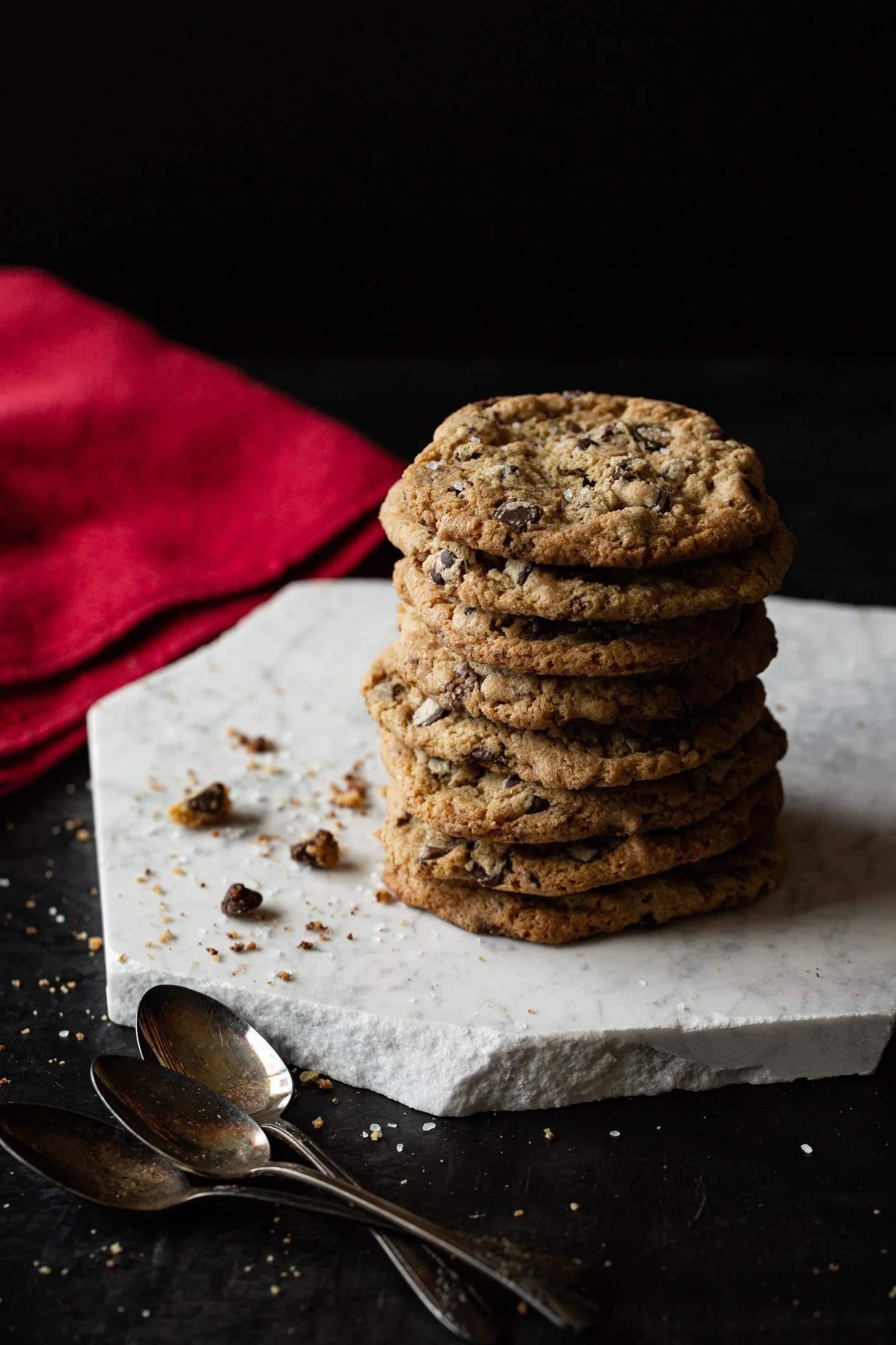 Stack of chocolate chip cookies on a marble stone slab