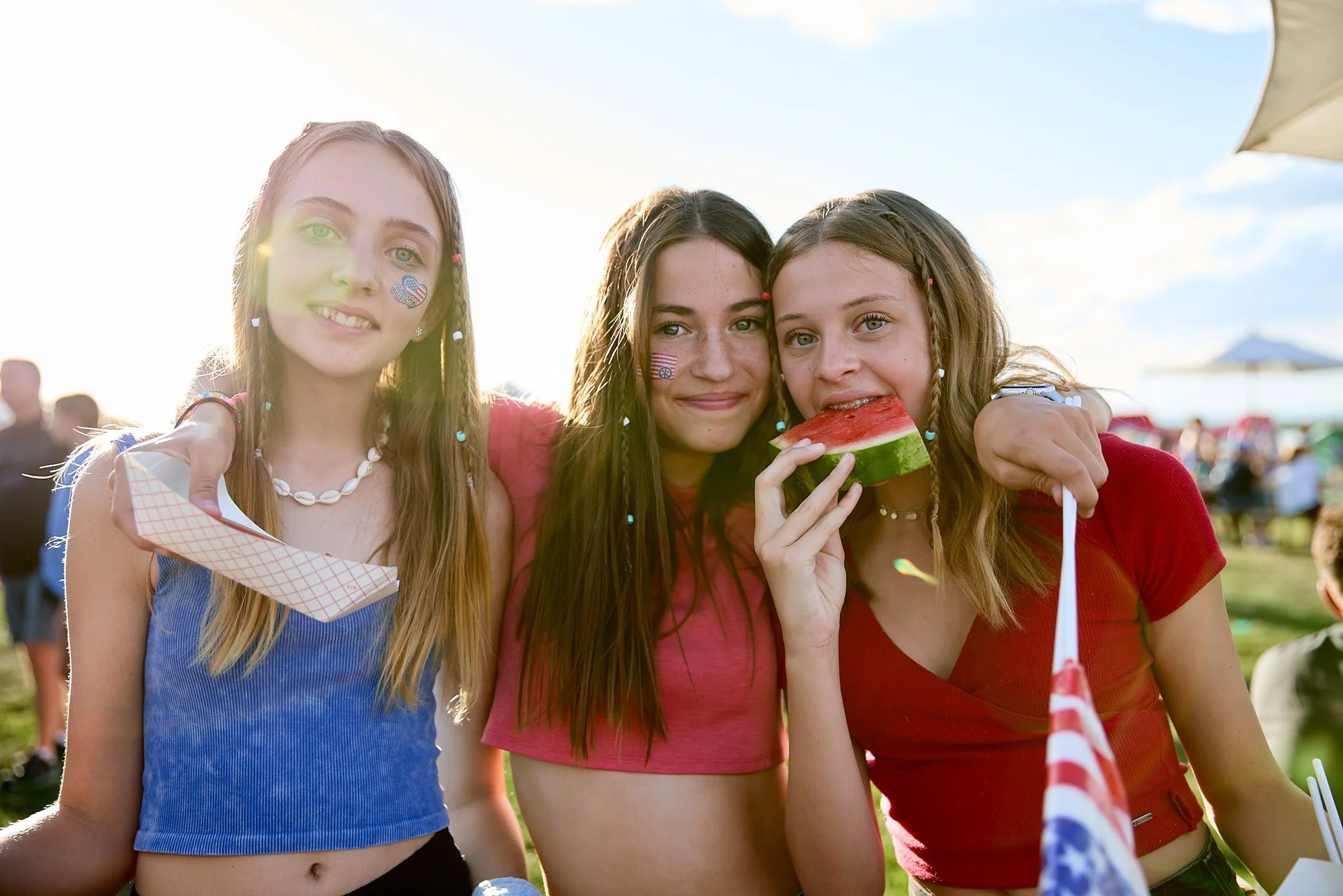 Three teenage girls enjoying 4th of July festivities