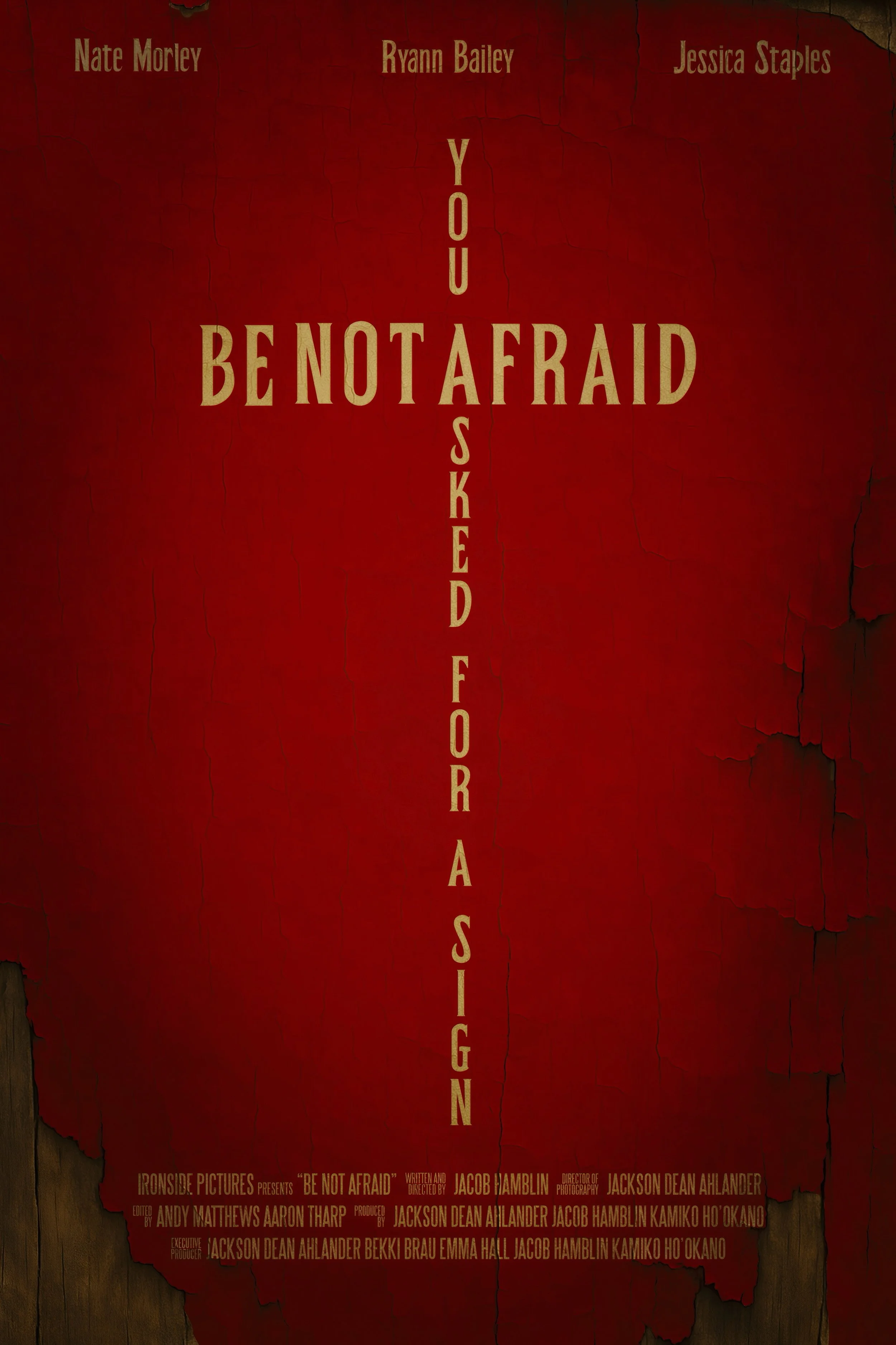 Poster for the film 'Be Not Afraid' with three actors' names at the top, red background with cracked and peeling paint, and film credits at the bottom.