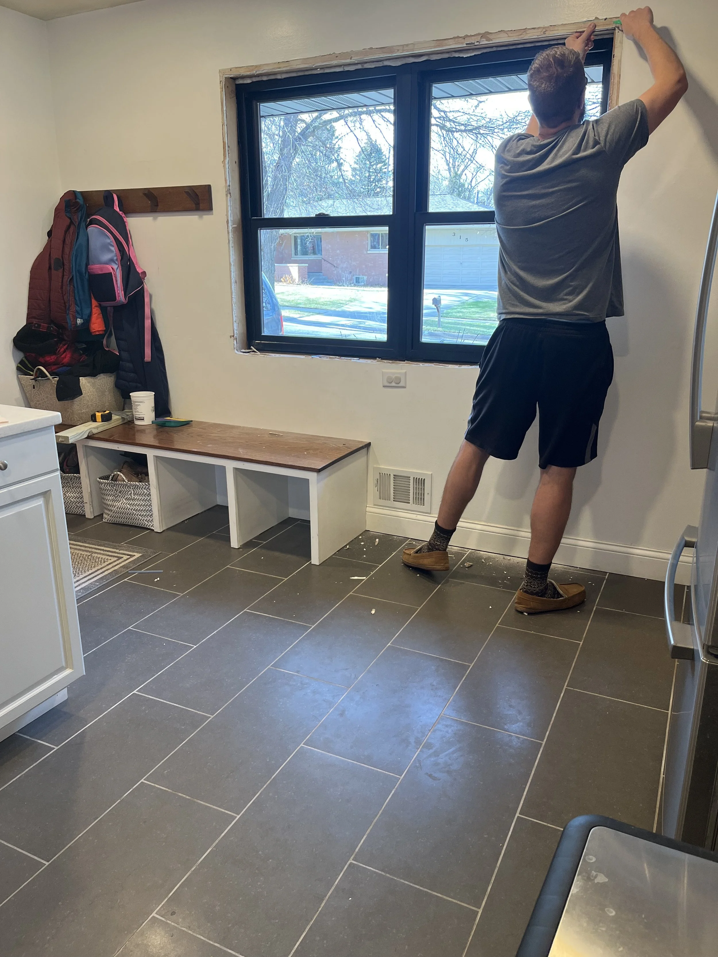 Trimmed out a new window. Also added a custom seat bench with cubbies for shoes.