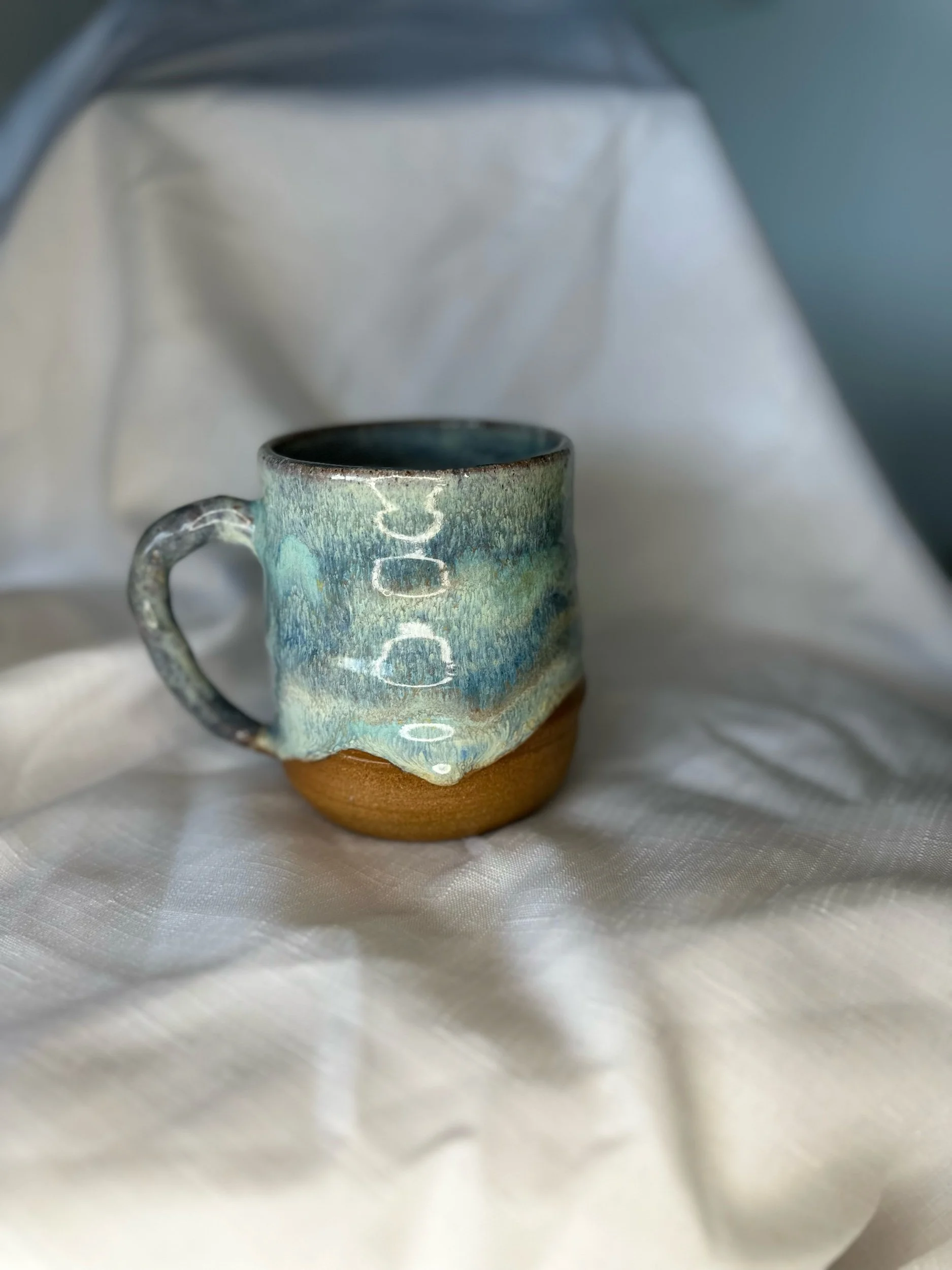 Blue glaze melt on brown clay
