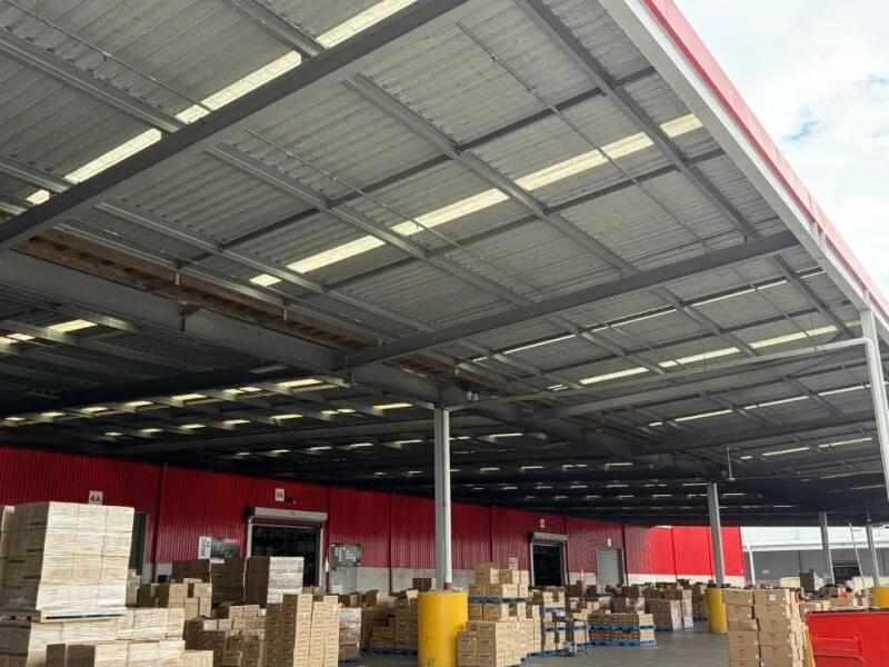 Commercial warehouse loading dock protected with bird proofing systems to prevent nesting and contamination