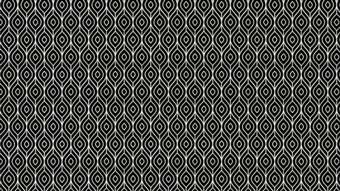 Black and white geometric patterned fabric with oval shapes and intricate lines.