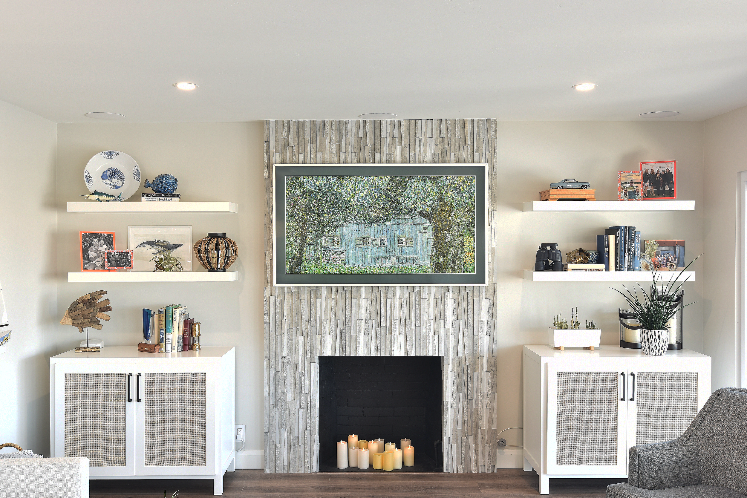 This is a remodeled house in Lake San Marcos.  They didn't want the typical "black" TV over the fireplace & visible AV equipment to dominate the look and their cool lake house vibe.  Samsung FRAME TV disguises the TV as a piece of art for a shockingl