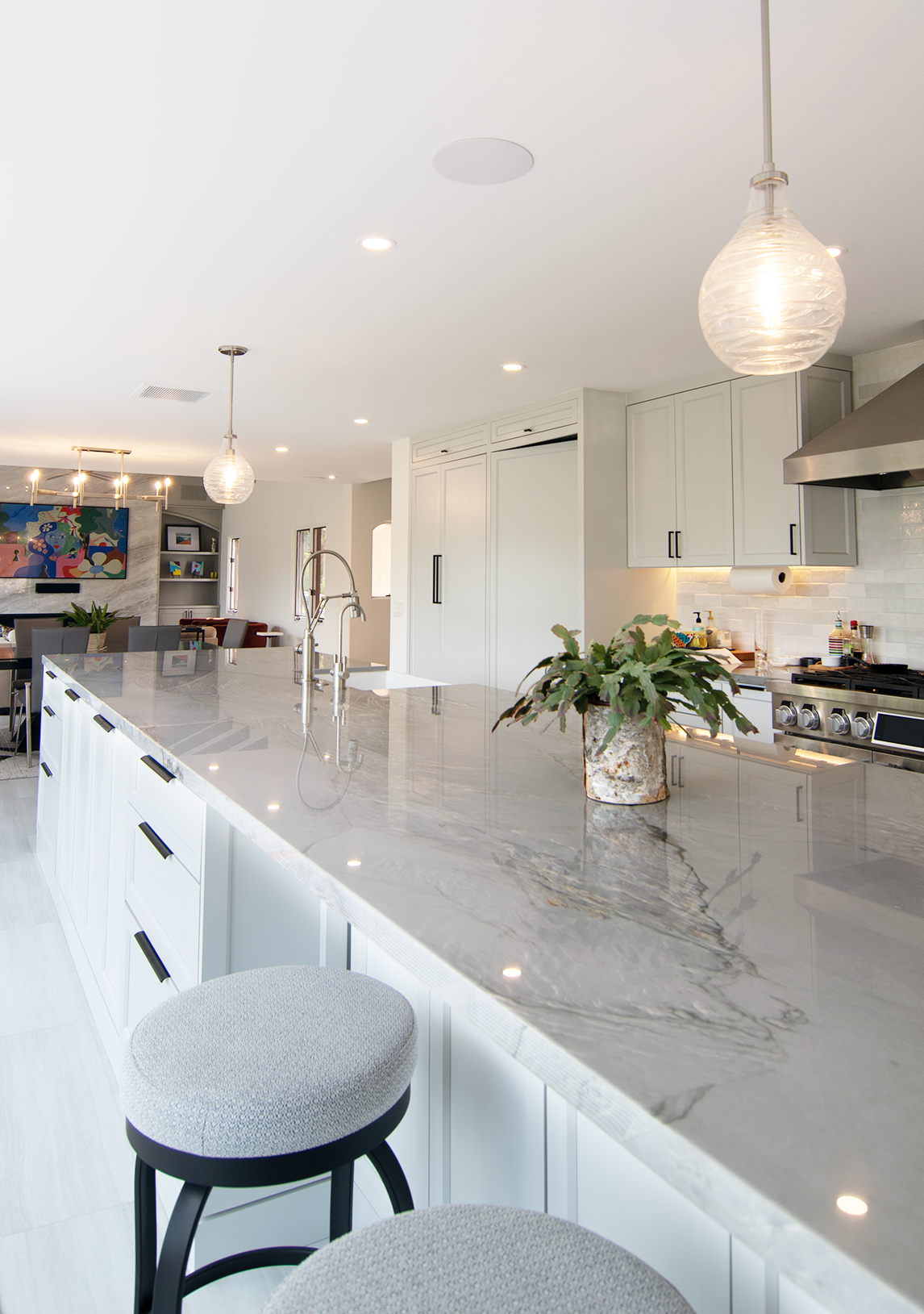 This remodeled home in Cardiff featured a remodeled Great Room & Kitchen.  Using flush mount speakers the Kitchen can operate as a separate zone or link to the Great Room surround sound system & Samsung Frame TV (shown in the background) 