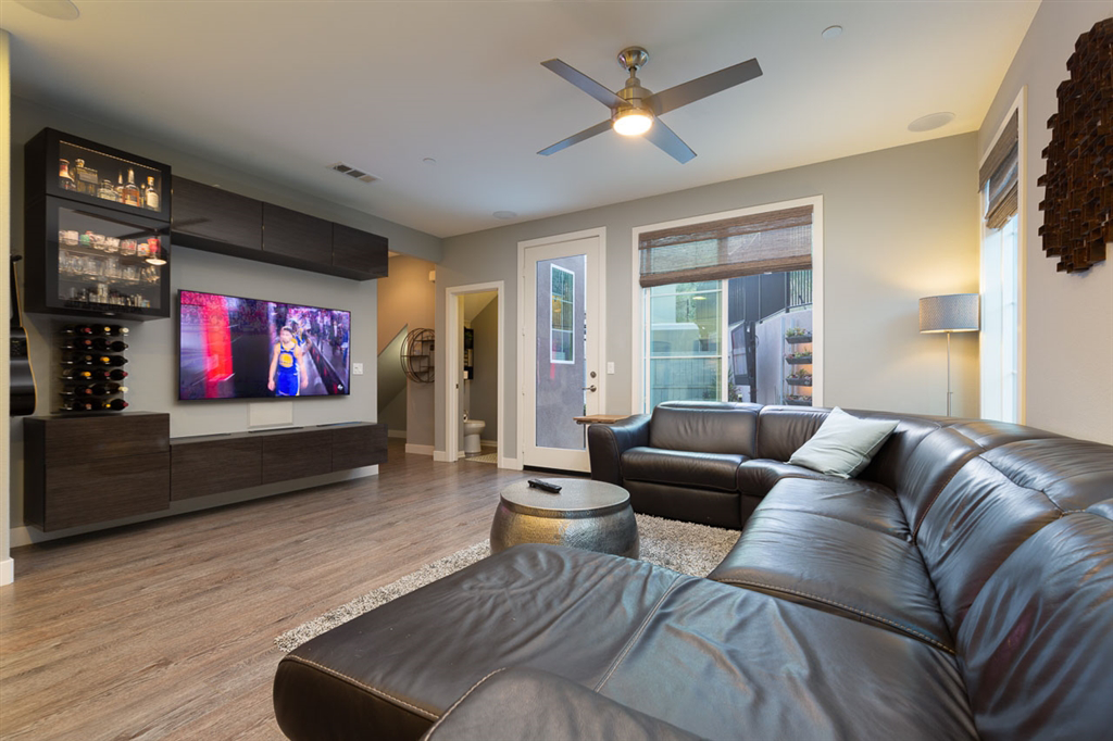 This is a small home in San Elijo Hills. We build a modern asymmetrical floating cabinet in an acrylic lacquer bamboo look. Cabinet has hidden ventilation and houses a full surround sound system with hidden flush mounted in ceiling speakers. Cool loo