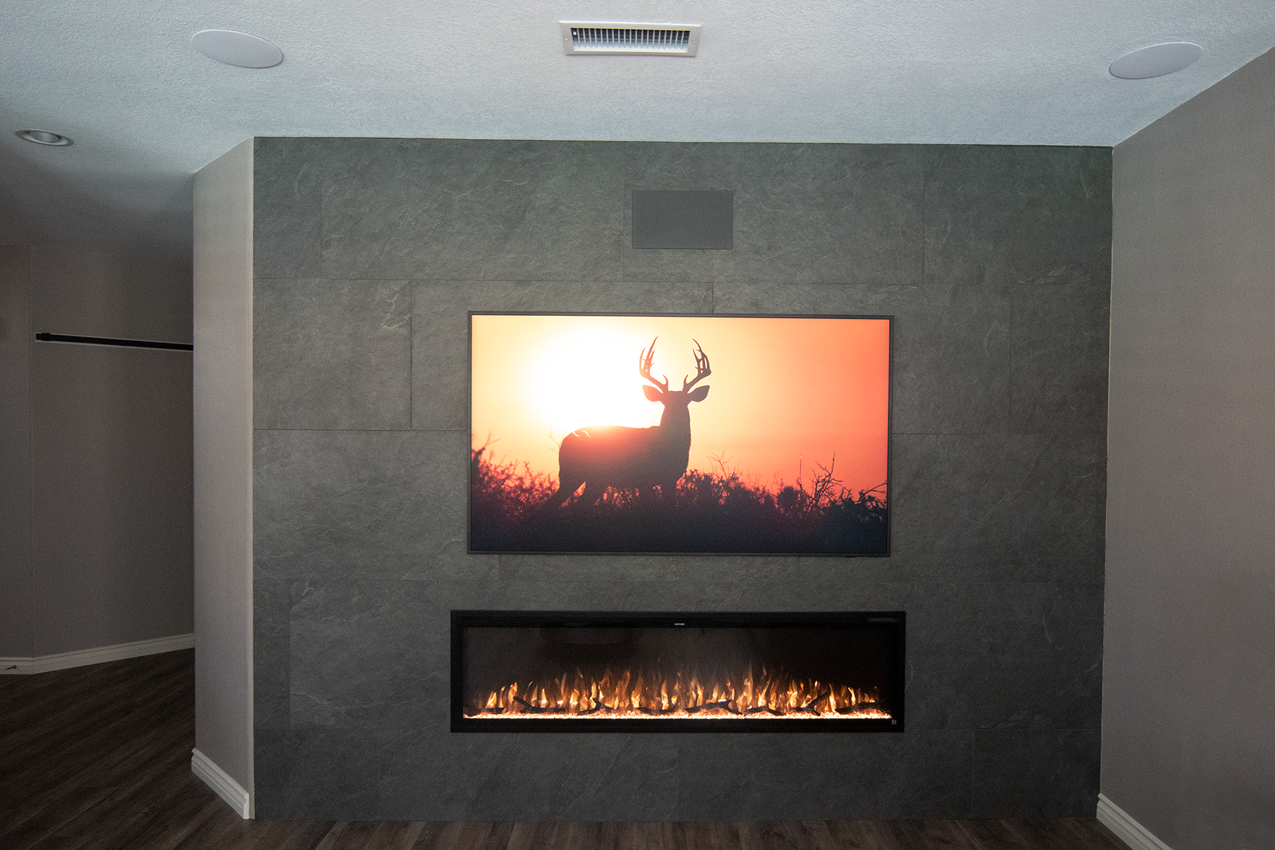 This remodel in Aviara area in Carlsbad was designed to give a modern look to a room that had a traditional track home fireplace and small alcove cabinet designed to handle a 36" tube TV (very dated). They wanted simple & clean. Completing the look i