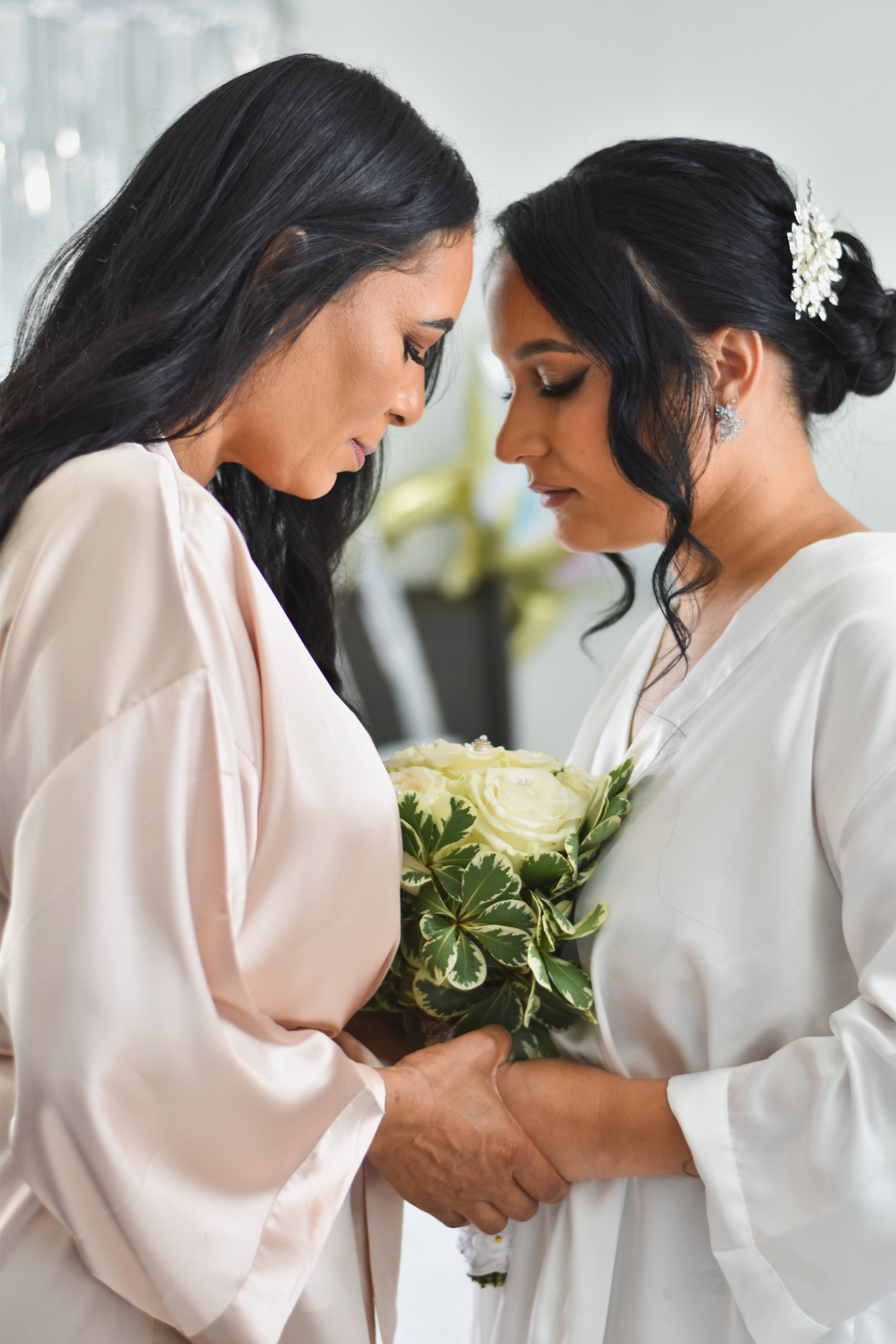 Bride preparation for her wedding with her mother