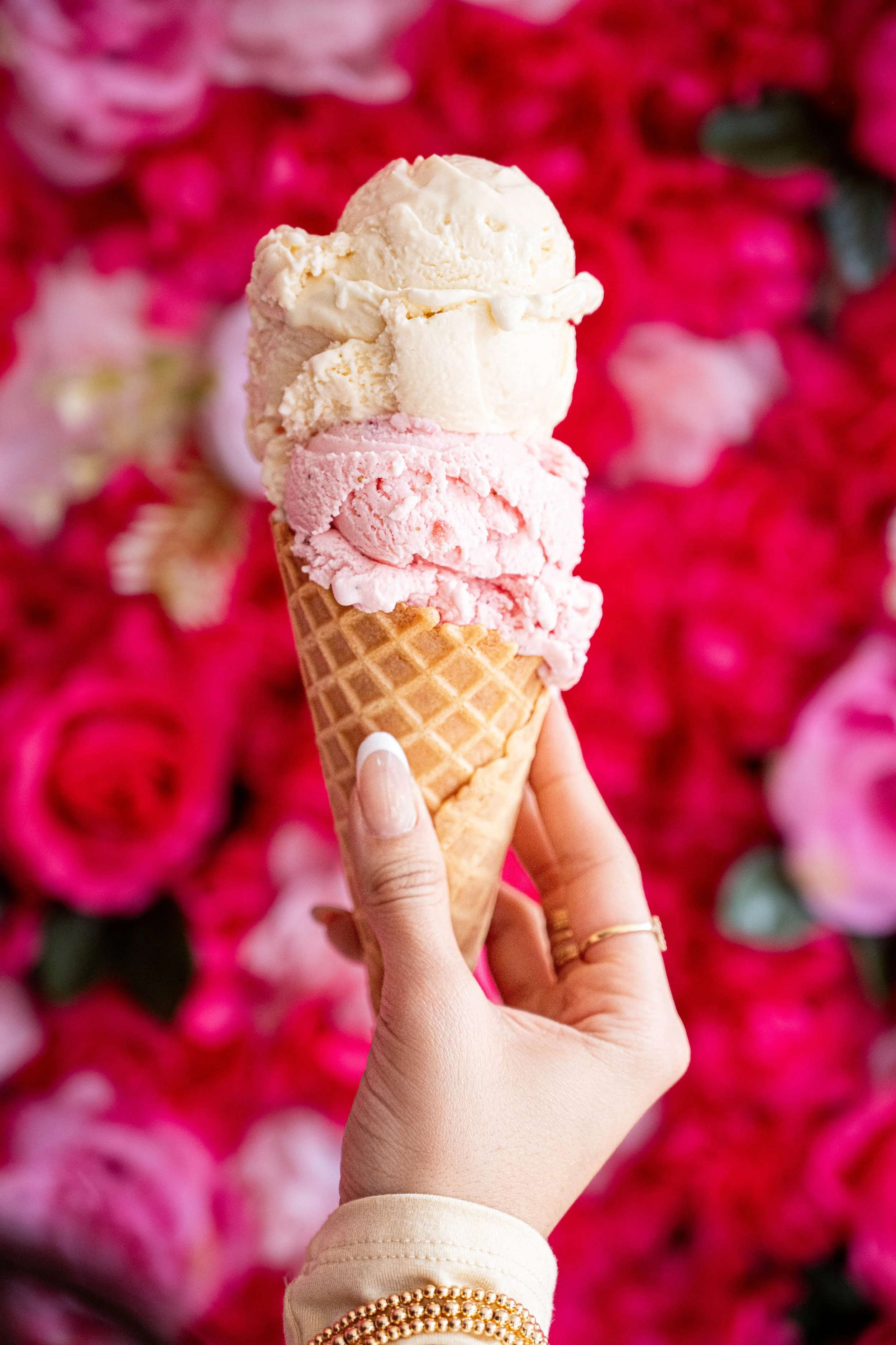 Holding Ice Crem toward flower wall-.jpg
