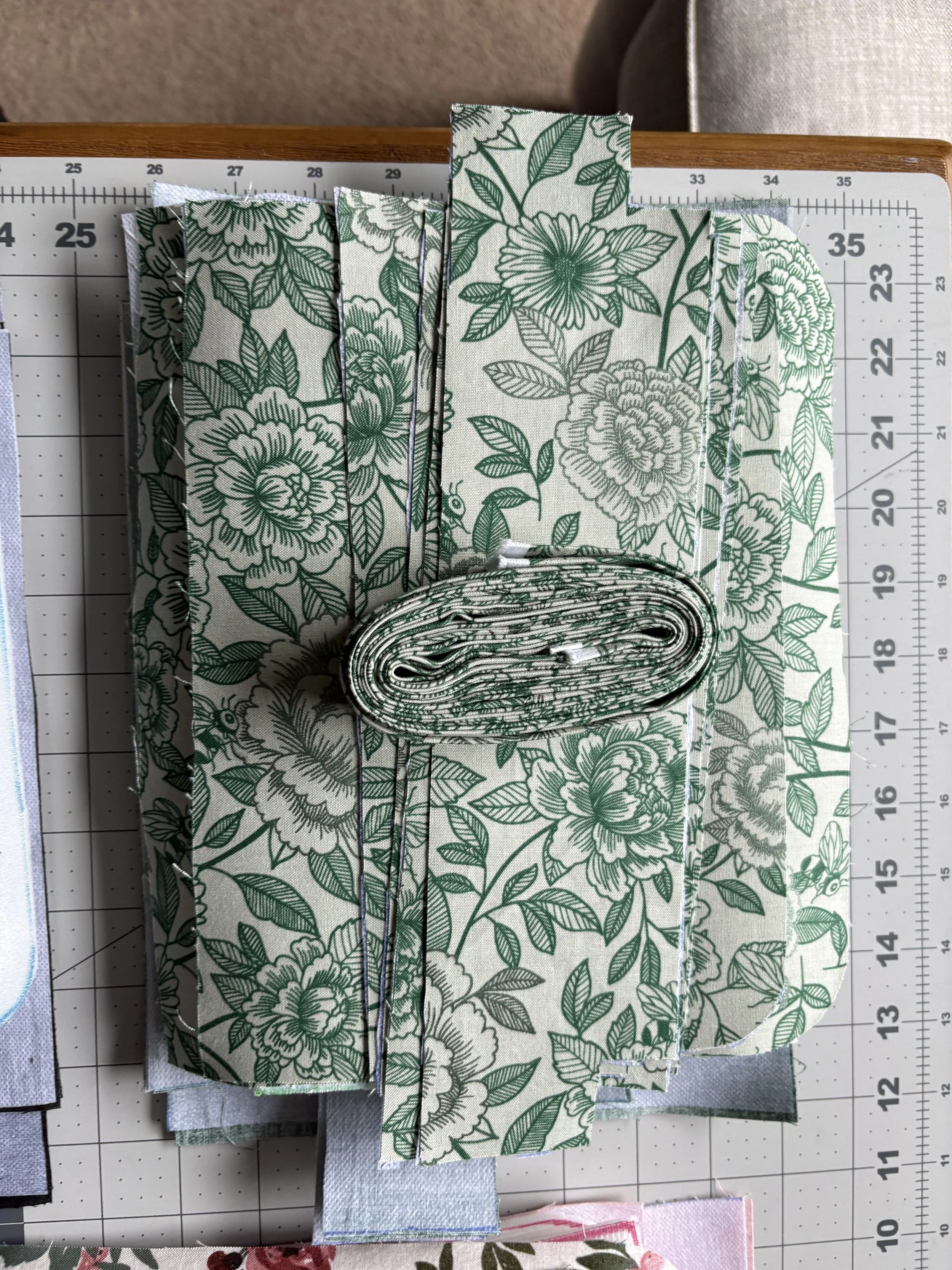 A single crossbody purse is constructed with 54 individually cut pieces, 3 zippers, 2 D-rings, 2 Swivel hooks, and a slide adjuster