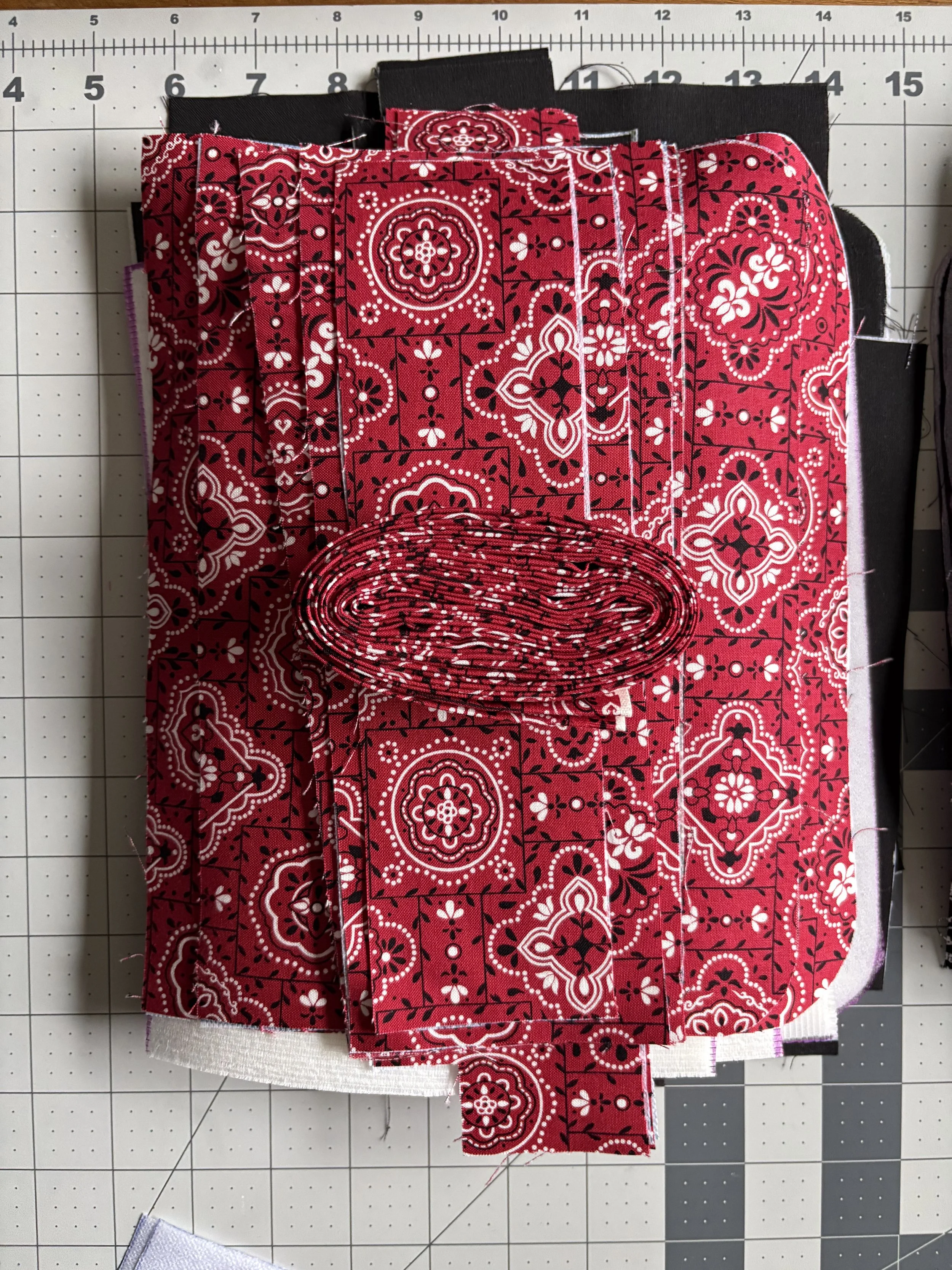 A single crossbody purse is constructed with 54 individually cut pieces, 3 zippers, 2 D-rings, 2 Swivel hooks, and a slide adjuster