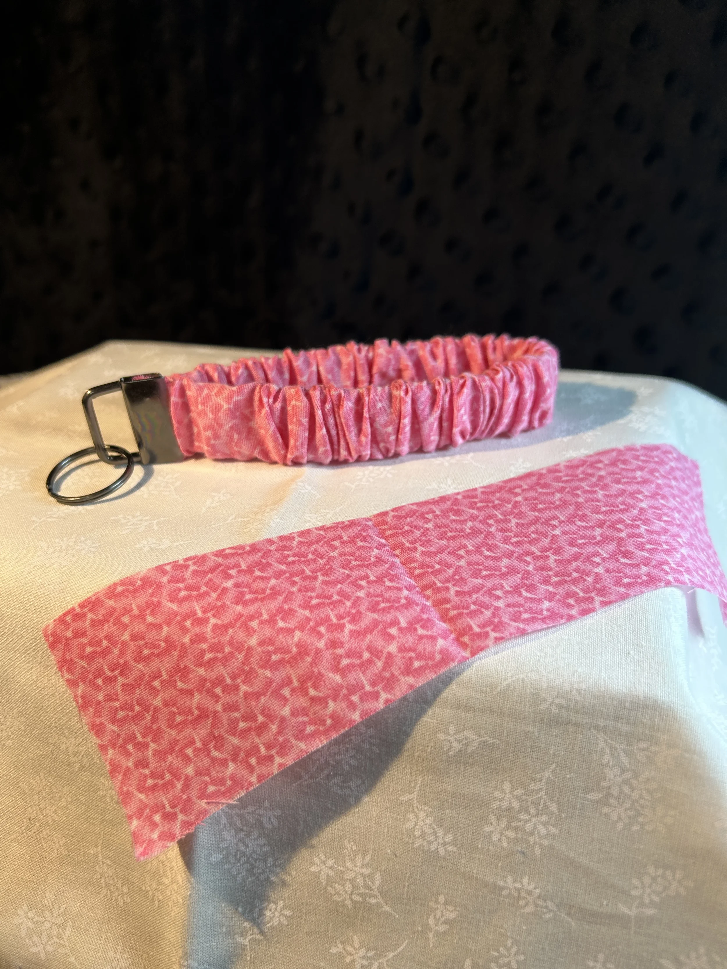 pink and white scrunchie keychain.webp