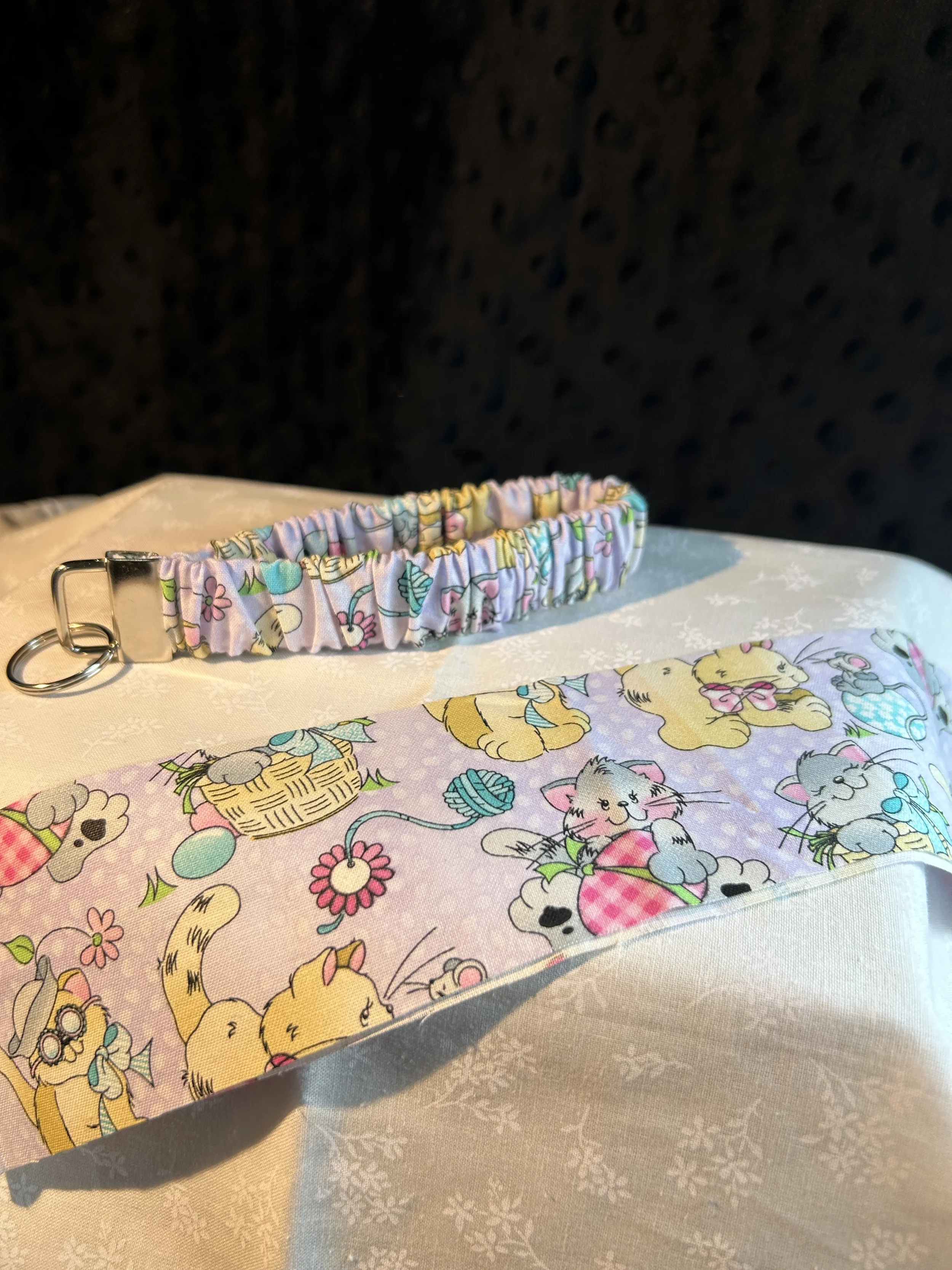 kittie playing scrunchie keyfob.webp