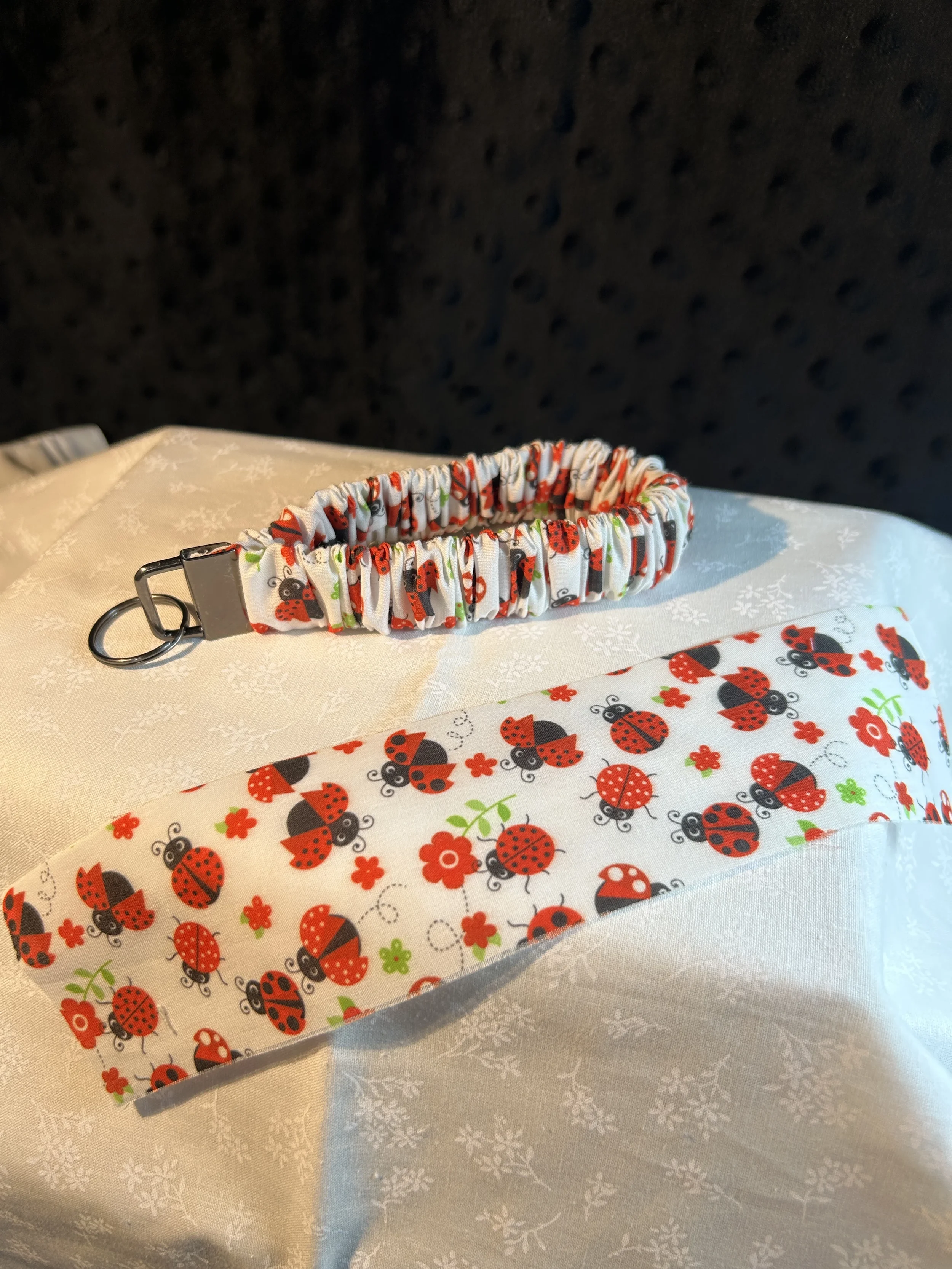 ladybug with flowers scrunchie keyfob.webp