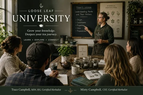 Loose Leaf University — Trace and Misty Campbell teaching a hands-on herbal tea class around a table with jars of loose leaf tea, a teapot, and botanical reference books
