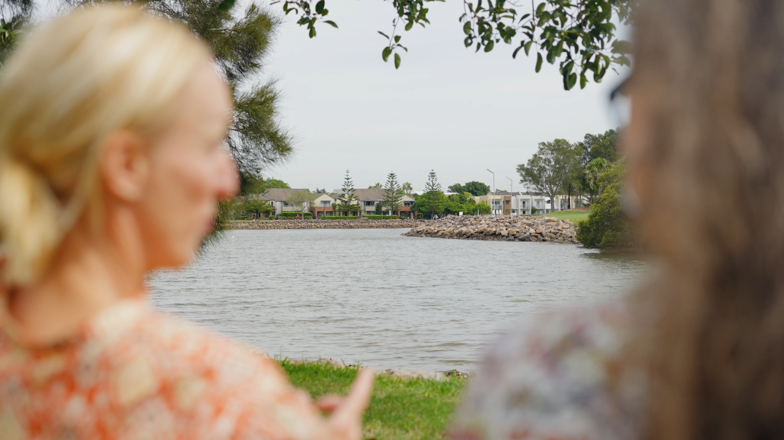 Two Newcastle Social Workers support coordinators speaking outdoors in the local community, reflecting approachable NDIS support coordination across Newcastle and surrounding areas.