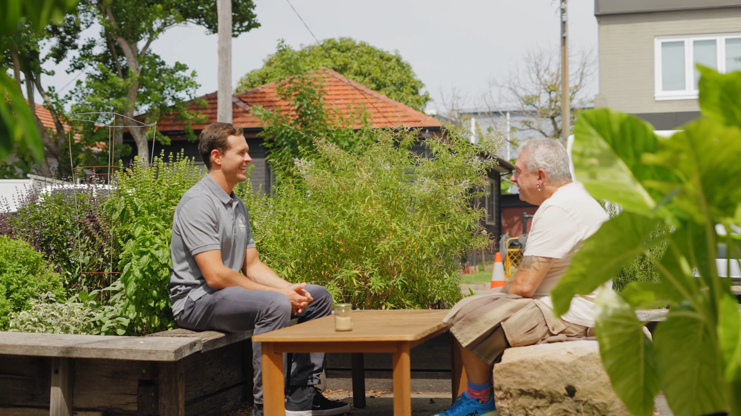 Kurt, Director of Newcastle Social Workers, having a relaxed conversation outdoors with a man in Newcastle, reflecting local and person-centred NDIS support coordination.