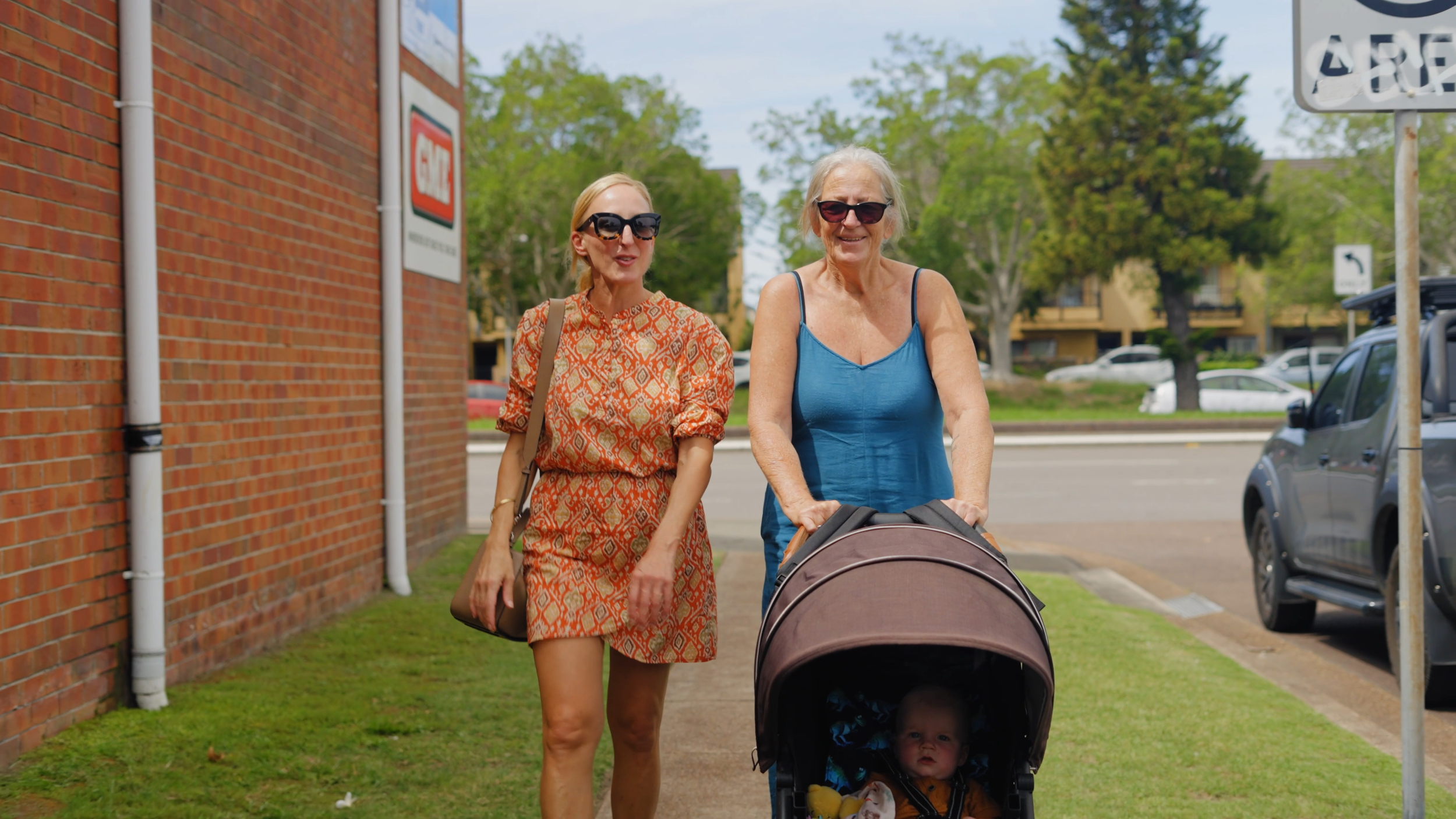 Simone from Newcastle Social Workers walking with an NDIS participant and child in Newcastle, reflecting local, person-centred support coordination.