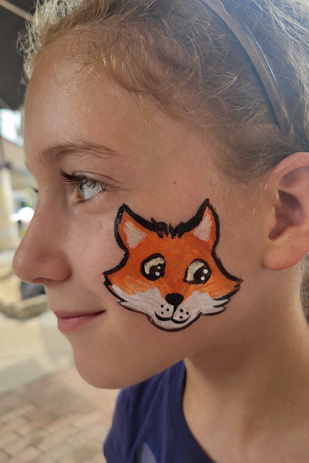 cute fox face painting in madison wisconsin at an art fair by witty kitty face painting