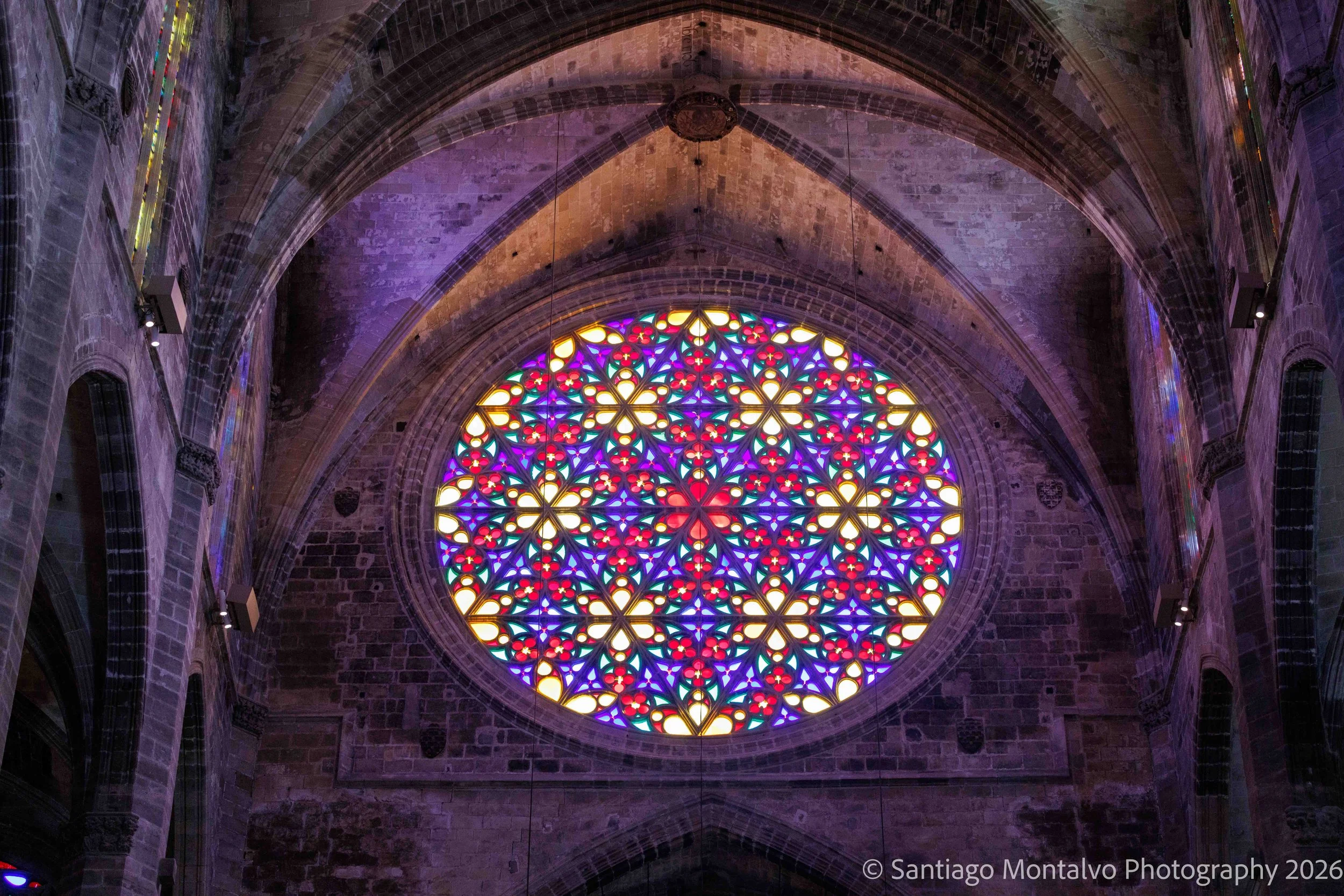 A Rose of Light — Palma de Mallorca, Spain. An extraordinary stained-glass rose window fills sacred architecture with color.