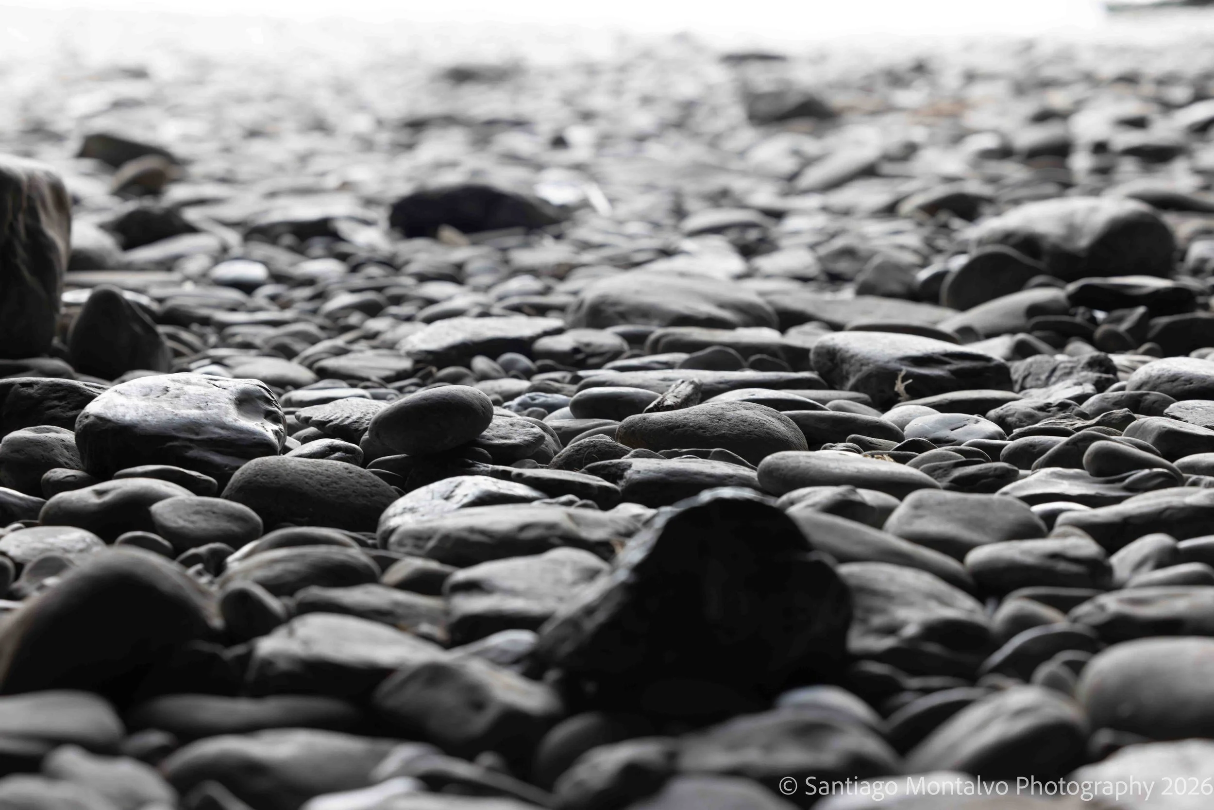 The Shape of Stillness — Cinque Terre, Italy. An intimate monochrome study of pebbles shaped by the sea.