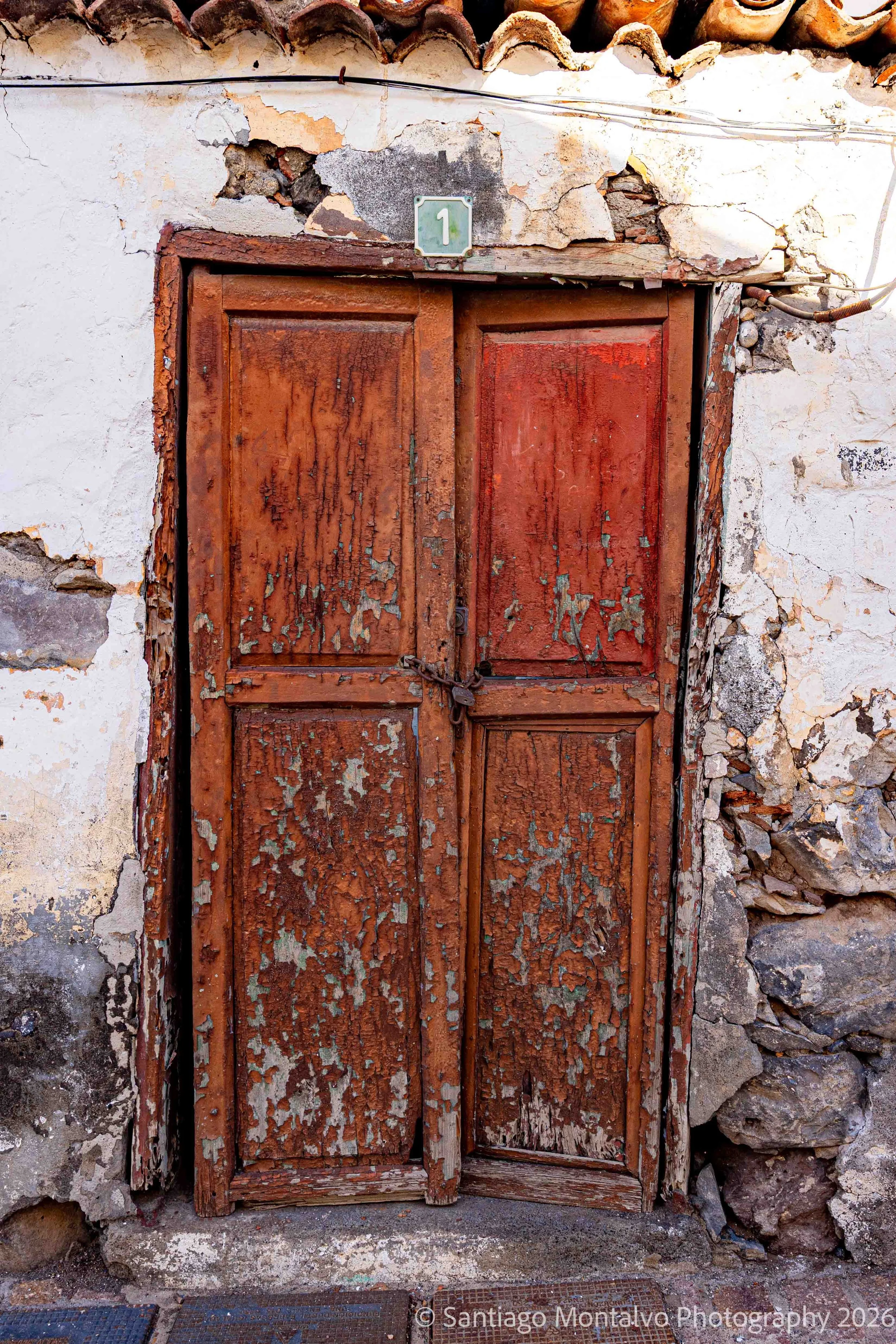 The Weathered Door — La Gomera, Spain. Peeling paint and timeworn wood tell a quiet story.