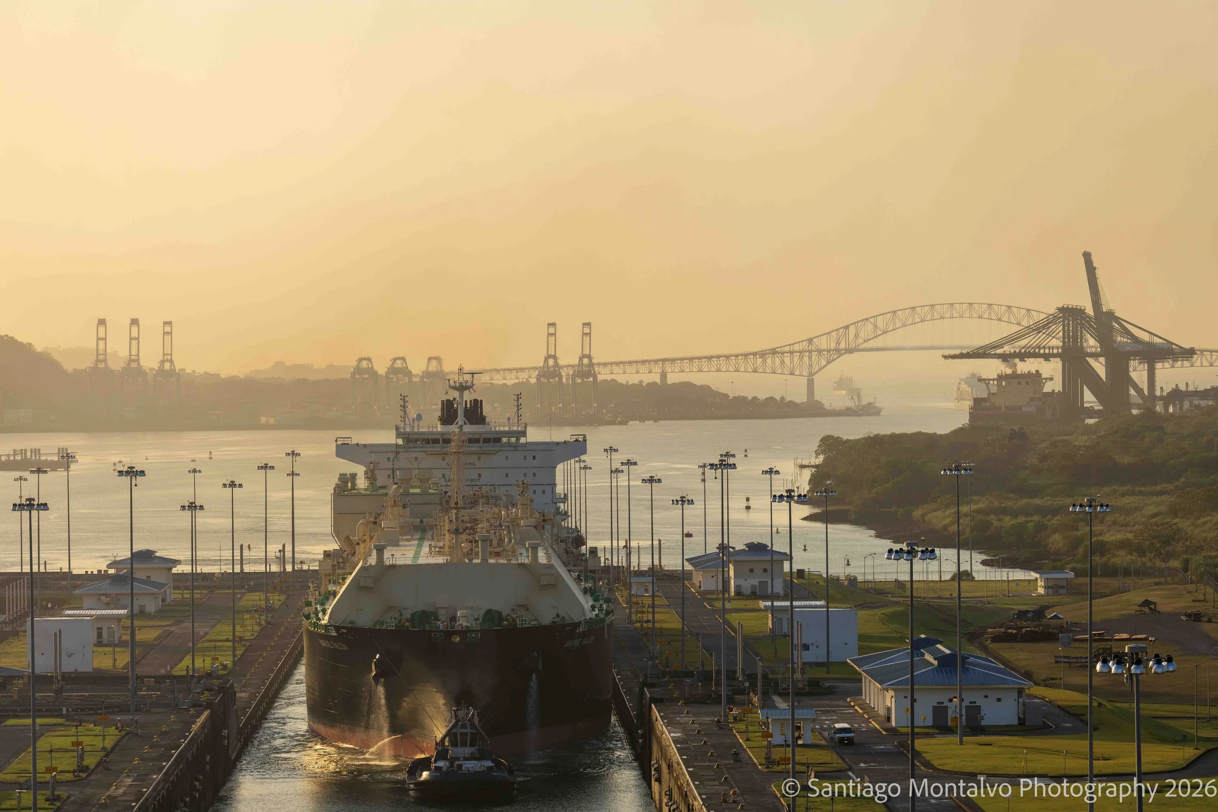 Golden Passage — Panama Canal, Panama. A great vessel makes its journey through a monumental feat of engineering beneath the warmth of golden light.