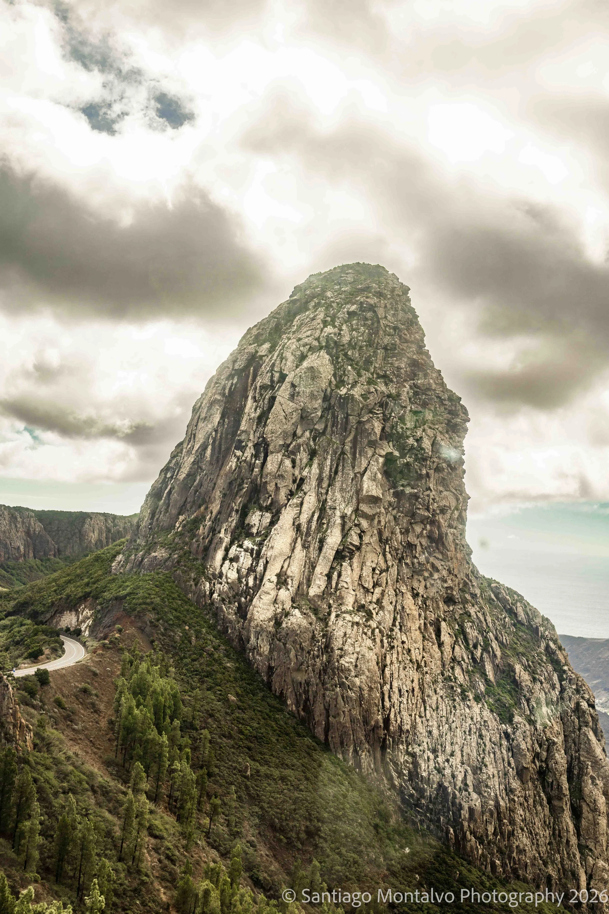 The Volcanic Sentinel — La Gomera, Canary Islands, Spain. An immense volcanic formation rises into the clouds.