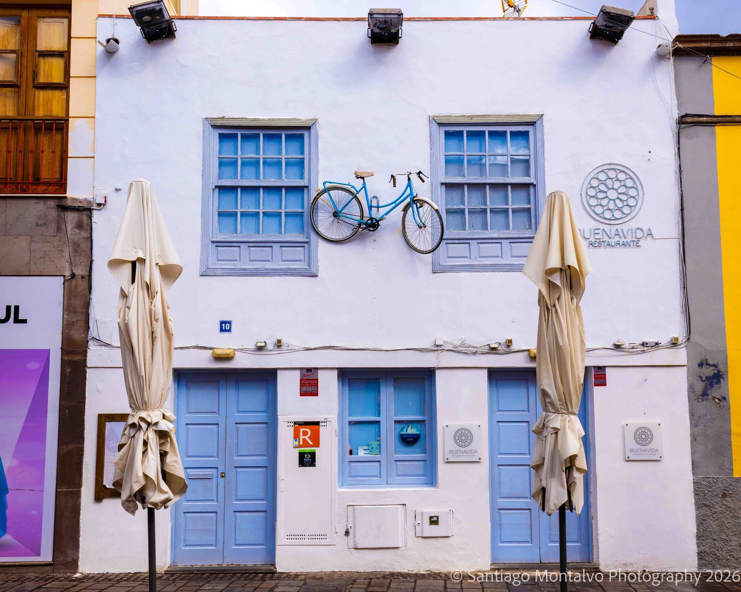 The Blue Bicycle — Tenerife, Spain. An unexpected splash of blue transforms an ordinary facade.