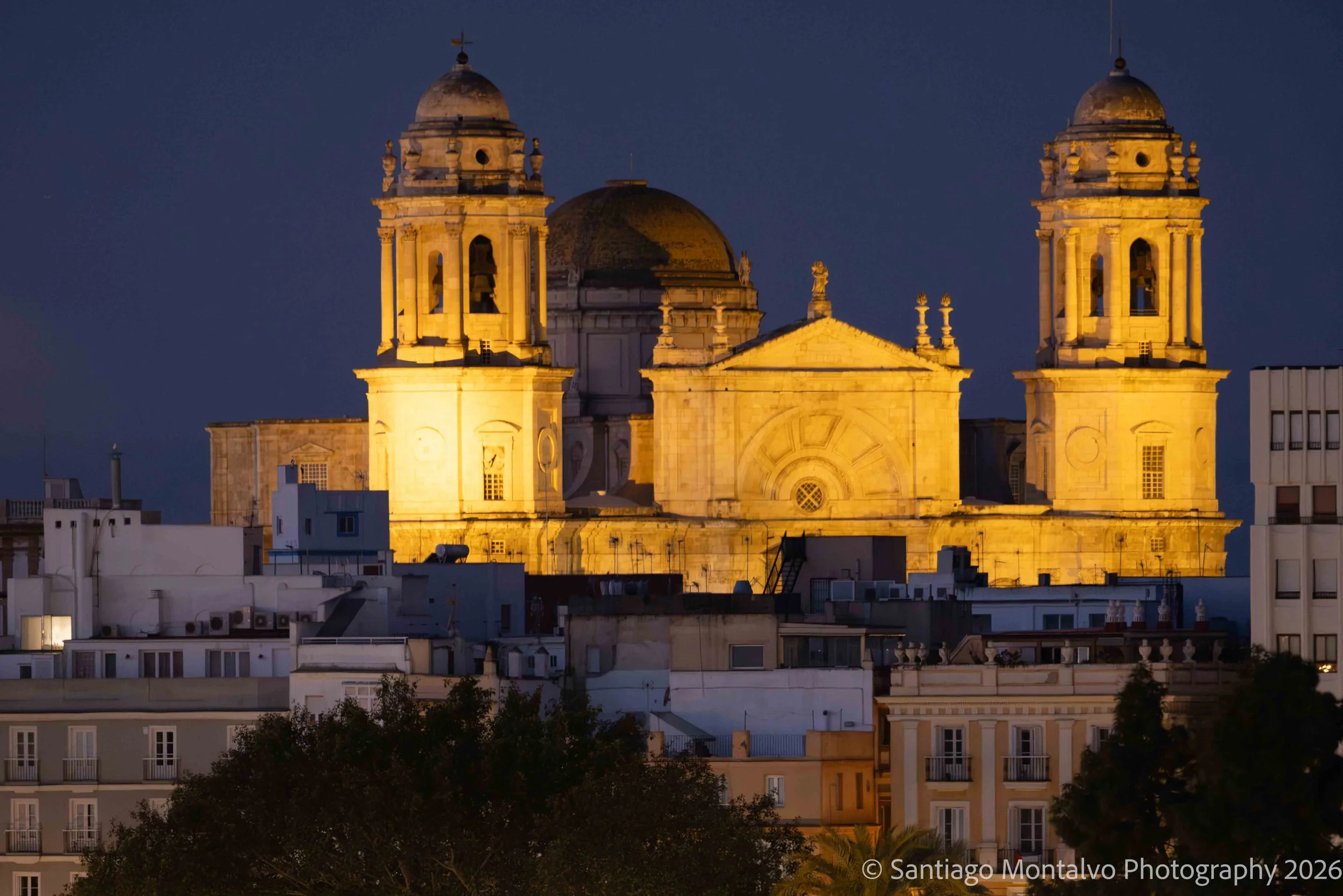 Illuminated Faith — Cádiz, Spain. A cathedral illuminated against the night sky becomes a striking symbol of history and devotion.