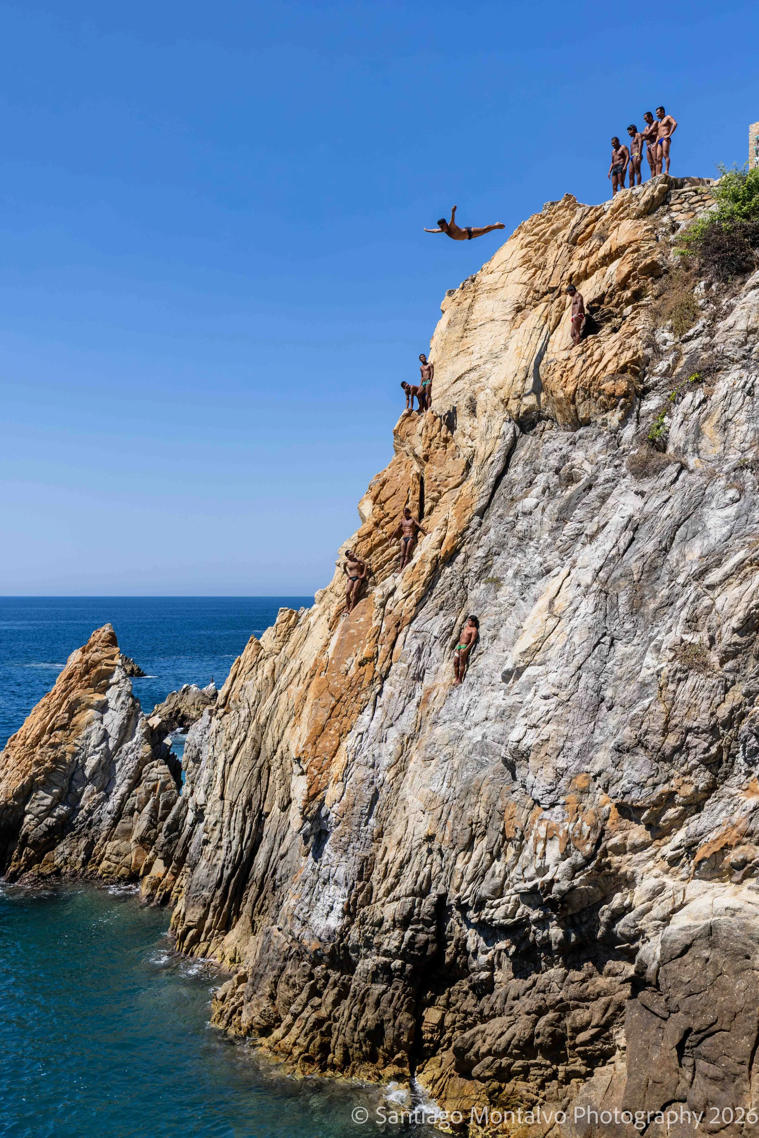 The Leap — Acapulco, Mexico. A daring cliff diver captures a remarkable moment of courage against the dramatic Pacific coastline.