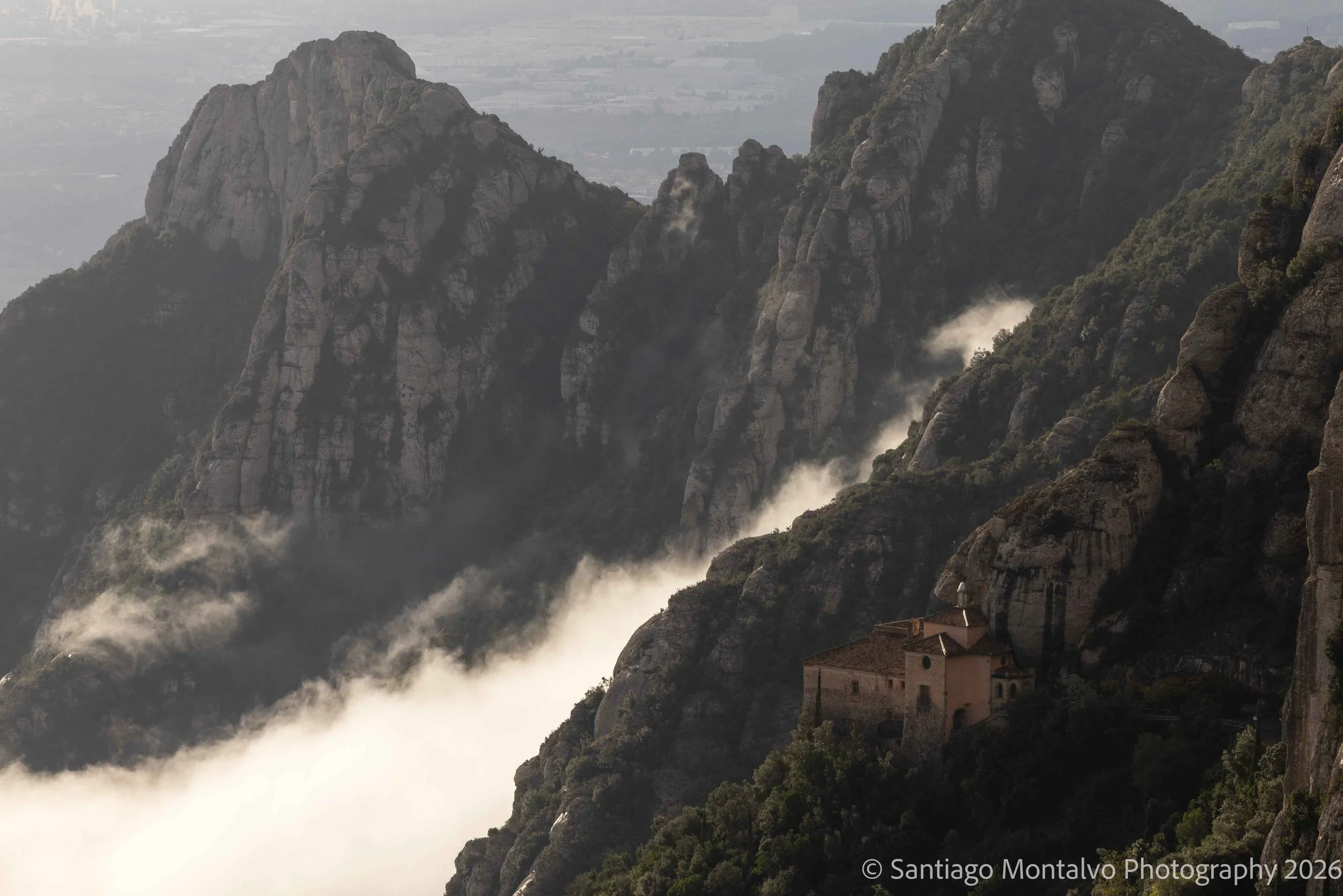 Between Earth and Heaven — Montserrat, Spain. A sacred sanctuary framed by monumental mountains and dramatic clouds.